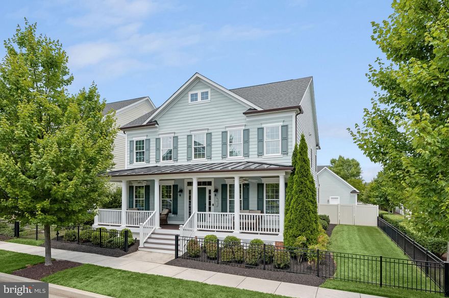 Offer Deadline Monday, July 3rd at 12pm.  Beautiful Beaconsfield model by NV Homes, located in Fulton’s amenity rich Maple Lawn community. This home boasts a front porch overlooking community green space and updates that include the recently renovated kitchen, primary bath, fixtures throughout and more!  Enter through the covered front porch to a bright and airy foyer highlighting hardwood flooring, and a soothing neutral color palette.  Wide archways open to formal living and dining rooms showcasing tray ceilings and accent molding, creating the perfect ambiance for intimate gatherings.  The gourmet kitchen has been updated with an oversized island, quartz and leathered granite countertops, white herring bone backsplash, white and dark cabinetry, and high end stainless appliances.  An impressive coffered ceiling is detailed in the off kitchen family room that offers a cozy fireplace.  There’s an office behind glass French doors and a powder room.  Ascend the staircase to the primary bedroom suite accented with a tray ceiling, a walk-in closet and attached luxury bath with an oversized shower with decorative tile inlay, and dual vanities. Three sizable bedrooms and a hall bath complete the upper level.  A recreation room with a dry bar and beverage refrigerator, a full bath, and flex room or potential 5th bedroom are located on the lower level.  Enjoy outdoor living on the expansive stone patio and flat green space in the private fenced back yard.  Maple Lawn offers an extensive list of amenities that include a swimming pool, sports courts, tot lots, and more!