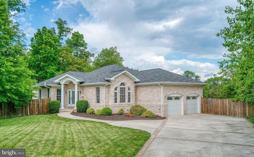 Feels like your own private retreat, but minutes away from city living. No HOA! Built in 2012, this 5BR/3.5BA home features hardwood floors, tall ceilings, and an updated kitchen with granite counters and  stainless appliances.  Enjoy peaceful views of Little Burgundy Farm from your spacious deck—perfect for summer nights and entertaining The main-level primary suite offers a walk-in closet and en-suite bath, plus two more bedrooms with scenic views. A fully finished walkout basement adds a massive rec room, two bedrooms, and a full bath. There's also plenty of storage. Two-car garage and just 1 mile to I-495 & Huntington Metro!