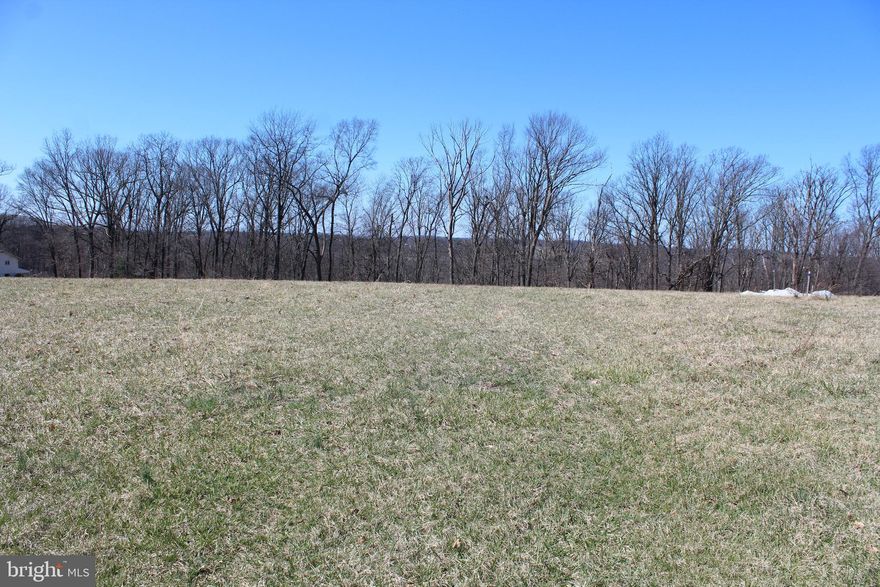 No Builder tie-in. Use your own builder. This 2.30-acre lot in the picturesque Carroll County/Manchester area offers a peaceful retreat surrounded by natural beauty. The land is spacious and offers plenty of room for various outdoor activities, with ample space for a home, garden, or additional structures. A well is already on-site, making it an ideal location for someone looking to build or establish a self-sufficient property. The landscape is level to rolling  and open areas that capture the essence of country living. Whether you're looking for a quiet getaway or a place to build your dream home, this lot provides the perfect blend of tranquility and convenience. Carroll County's charm and community spirit, combined with this expansive lot, make it an exceptional opportunity for buyers seeking a serene lifestyle.  This lot is newly recorded in Manchester known as the "Huber Property".  Beautiful 2.30 acre clear lot with included well.  Well depth is 500' @ 2.0 GPM.  Perc approved for a 4 bedroom sand mound septic system. No covenants, restrictions or HOA.  Lot is ready for a building permit application. Perfect lot for a Rancher or Colonial New Home. Additional 2.47 acre adjoining Lot 1 is also available for sale. See MLS#MDCR2030810.