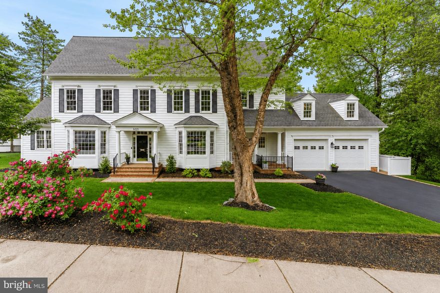 Welcome to this exceptional custom-built residence, thoughtfully designed by renowned architect Claude Lapp and constructed in 2007 by award-winning Welty Homes.

Perfectly positioned on a beautifully landscaped 0.3-acre corner lot in the heart of Bethesda, this sophisticated home offers timeless architecture, refined finishes, and an ideal floor plan for both everyday living and entertaining. A covered front porch, brick and flagstone walkway, French windows with wood mullions, and mature landscaping create striking curb appeal, while recent updates including fresh interior paint and new carpet throughout the upper and lower levels in 2026 provide a crisp, move-in ready feel.

Inside, hardwood flooring, recessed lighting, double crown molding, and French glass pocket doors enhance the elegant yet functional layout. The gourmet kitchen serves as the heart of the home, featuring abundant 42-inch white cabinetry, granite countertops, stainless steel appliances including a gas cooktop and double ovens, a center island with bar seating, and a breakfast area with built-in bench seating and plantation shutters. The kitchen opens seamlessly to the inviting family room with custom built-in bookcases, a gas fireplace with wooden mantel, and built-in surround sound system. Additional main level spaces include a sunroom with vaulted ceilings and access to the private rear deck, a formal living room with bay window, and a gracious dining room showcasing chair rail molding, bay window, and historic built-in china cabinets salvaged from the original 1919 home once located on the property. A versatile main level office or optional bedroom features original built-ins, plantation shutters, and direct access to a full bathroom. The thoughtfully designed mudroom includes a separate entrance, sink, cubby storage, cabinetry, and refrigerator rough-in with water line, while an attached two-car garage and three coat closets add convenience. A pre-wired elevator shaft servicing all three floors provides the easy capability to add an elevator in the future.

Upstairs, the spacious primary suite offers two walk-in closets and a luxurious bath with dual vanities, oversized shower, Jacuzzi tub, and private water closet. Three additional bedrooms include one with an en-suite bathroom and walk-in closet, while two others share a Jack-and-Jill bathroom with dual sink vanity. A well-equipped laundry room with cabinetry, folding counter, and hanging space is also located on the upper level. An expansive unfinished bonus room above the garage is insulated, pre-wired, and ready to become a home gym, office, or playroom.

The finished lower level provides impressive additional living space with high ceilings, a large recreation room with walkout access to the yard, a full bathroom, generous walk-in storage closets, and two oversized storage and utility rooms.

Ideally located approximately 1 block from National Institutes of Health, less than 1 mile from Walter Reed National Military Medical Center and Medical Center Metro Station, and moments from Downtown Bethesda, Wildwood Shopping Center, and the neighborhood Maplewood-Alta Vista Local Park, this exceptional home combines luxury craftsmanship, modern functionality, and an unbeatable Bethesda location!