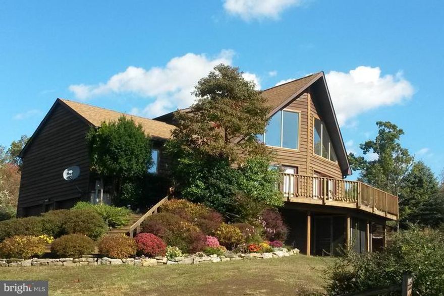 Stunning Chalet-style Contemporary home on 1.44 acres.  Open floor plan features great room, kitchen with separate dining room and 2 bedrooms on the main level.  Upper level master en suite with overlook to the great room.  There are many new features including stainless steel appliance, granite counter tops, new flooring, new HVAC and more!