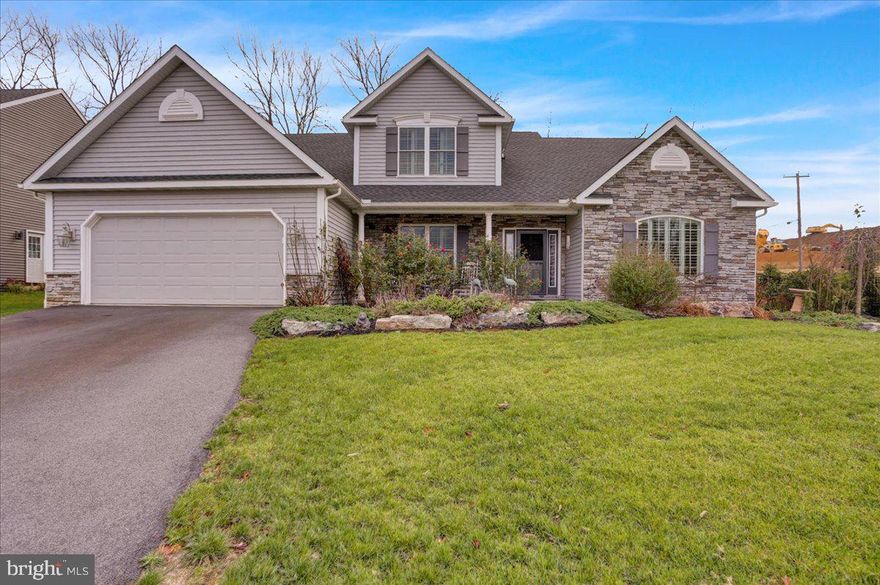 Your Dream home is already built and no HOA!   Get out your Welcome sign!   This rare opportunity can be yours in this nearly new, top-tier home on a corner lot in Wilson Schools.    You will love this elegant 1.5 Story, with open floor plan, that was designed with superior, main level amenities.

Be prepared to say WOW as you walk-in the front door and Imagine yourself entertaining in the formal dining room with gorgeous hardwood flooring, tray ceiling and crown moldings.   Oh the decorating possibilities.  Your eyes will be drawn to the beautiful custom plantation blinds in most of the windows.   On the right is the living room that can be used as a study, office or reading area.    Next, is the grand staircase everyone wants to use for photo ops at holidays, birthdays, proms etc. and it overlooks the large family room featuring bright skylights in the cathedral ceiling and gas fireplace with stone surround.   There are also hardwood floors throughout the living room, family room and primary suite.    The first floor primary spacious master has a vaulted ceiling and a luxurious custom tile shower with dual shower heads and seat.     At the top of the stairs are 3 additional bedrooms, hall closet and common bath.   But first, head over to the tiled kitchen area and check out the attached sunroom perfect for reading in the sunshine or just having some coffee and toast.     Enjoy cooking, or ordering take-out buffet on this gorgeous granite island.    And my personal favorite is the laundry room on the main floor.    Do you like entertaining outside?   While you are relaxing on this low maintenance composite deck, you can have peace-of-mind with this custom pet friendly fence as it was built with smaller friends mind and they shouldn't fit through the lower portion.  (no guarantees)  Front landscaping includes fountain and garden boxes in rear yard.   Additional basement stairs through the garage.    So much more, you need to see!