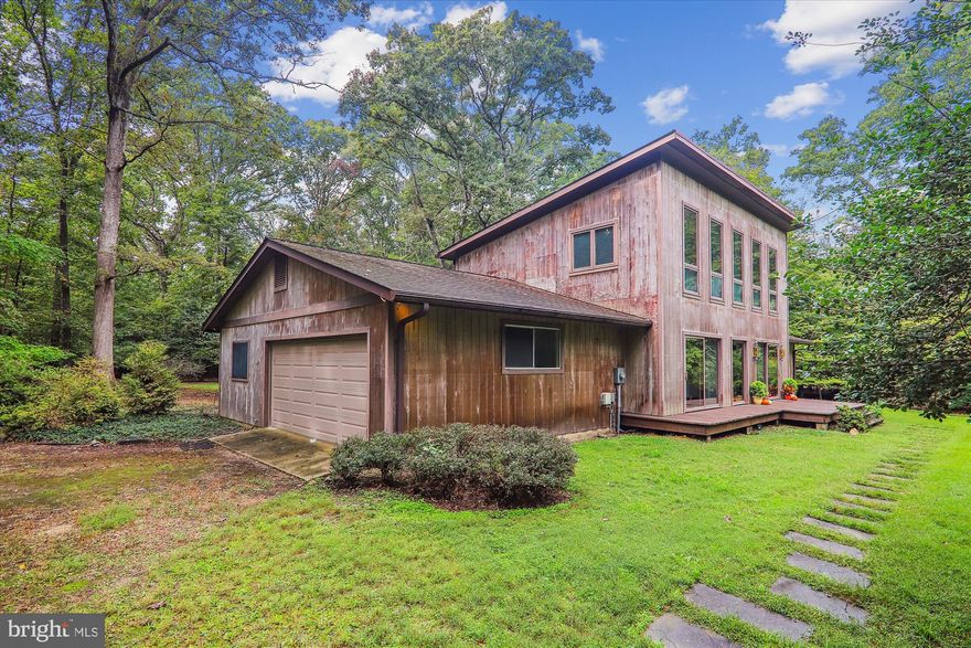 Welcome to serenity! This Mid-Century Modern home offers unparalleled tranquility and stunning woodland privacy, riverside farms, and vibrant community wetlands. Immerse yourself in the rich history and natural beauty of the esteemed Piscataway Park System with this captivating property, now fully available! Situated on 7.46+/- secluded acres within The MOYAONE RESERVE, this home stands as a testament to the conservation-minded spirit of its residents. With over 200 homeowners dedicated to preserving the land, you'll enjoy expansive gardens and homesites while relishing in the untouched splendor of the surrounding landscape. As part of the Mount Vernon Viewshed, The Moyaone Reserve is steeped in history, with ties to the storied past of Accokeek. Residents can explore nearby historical sites, such as the Accokeek Foundation at Piscataway Park, delving into the area's multigenerational heritage. With its seamless integration of contemporary comforts and timeless charm, The Moyaone Reserve offers a distinctive living experience for those seeking a blend of luxury, community, and historical significance.
        Nestled in a quiet and secluded setting, this naturally weathered cedar siding home warmly invites you to entertain or to live and immerse yourself in nature. The large front and rear decking overlook the generous rear and front yard spaces and are ideal for entertaining, outdoor dining or just the quiet cup of coffee in the morning!  Oversized windows and sliding doors almost allow a seamless transition between indoor and outdoor spaces, with the natural lighting and the beauty of the environment to be appreciated from every room within. A generous floor plan permits you to cook and dine in the large country kitchen with direct access to the rear deck. Enjoy your day to day happenings in the spacious Living Room, or separate Family Room; choose if you want to set up your Office Space /or use the additional room for work or play (alternate main floor bedroom or suite?);  providing as much privacy as you choose! The generous upper floor bedrooms (4) offer oversized windows with an abundance of natural lighting, vaulted ceilings, and plenty of opportunity for individual privacy. Additional features of this home include a large separate laundry room with interior garage access or exterior access as a mud room, a large two car garage, a separate RV Shed (sold "as-is"), and a large storage shed. Yet, despite its idyllic setting, you're just a short drive from the bustling energy of Washington, D.C., and The National Harbor.