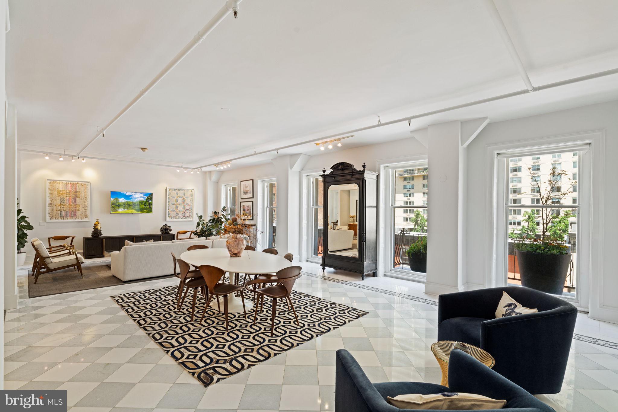For those who love to entertain and crave a home with space, style, and sophistication, welcome to 1920 Chestnut Street 5N - a 2-bedroom + den, 2-bath residence in an exclusive boutique elevator building steps from Rittenhouse Square. Offering over 2,000 square feet of contemporary design, this home seamlessly blends open-concept living with loft-inspired details, providing the ultimate urban experience.
The expansive living and dining area features soaring ceilings, oversized windows, and a seamless flow into the chef-inspired kitchen, complete with sleek cabinetry, premium appliances, and a generous island—perfect for entertaining. The city skyline shows-off from the landscaped balconies.
The primary suite offers a tranquil retreat with an en-suite bath and ample storage, while a second bedroom with a built-in Murphy bed and hall bathroom ensures comfort for guests. A versatile den provides the perfect home office or creative space.
Positioned in the heart of Rittenhouse Square, this home places you steps from acclaimed restaurants, luxury boutiques, and vibrant cultural destinations. For frequent travelers and NYC commuters, 30th Street Station and major transit lines are minutes away, with easy access to the airport—bringing the world to your doorstep.