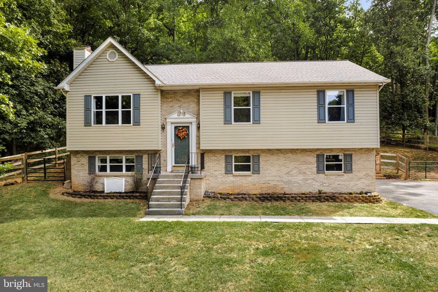 Have you been looking for a home removed from all the hustle and bustle while remaining close to all the comforts you love?  Welcome to 365 Greenfield Road!   This lovely home is situated in the lower portion of the sought-after gated community of High Knob famous for its many amenities such as the large community pool, tennis, and pickleball courts, walking trails,  new playground, and its own access to the famous Appalachian Trail.
As you drive up the paved driveway you will notice the large front yard perfect for outdoor fun.  The oversized two-car garage has ample room for your vehicles and additional storage.  Watch your fur babies run in the fenced rear yard while sipping your favorite beverage on the screened back porch.  Spend cozy winter evenings around the beautiful stone fireplace in the lower-level family room before getting a good night's sleep listening to the sounds of nature in your expansive primary suite.  The flooring and appliances have been updated in this home so all you have to do is move in!   In addition to all of this, High Knob has its own regulated public water system so there is no need for individual wells, and for peace of mind, High Knob has its own snow removal crew.  Residents can also enjoy the many community events at the clubhouse such as Chili Cook-Offs, Line Dancing, and Wine Tasting. This one is a rare find.  Make it yours today!  (Some rooms have been virtually staged so you can see the possibilities!)