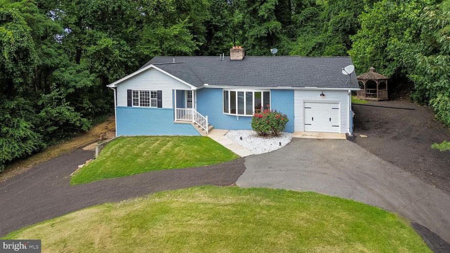 Welcome to this beautiful 5 Bedroom, 3 full bath rancher with one car garage in Wicomico shores.  This is two houses in one and will function well as multi-generational living.  Pull in through the large semi-circle driveway and enter through the covered front porch into the main floor.  The main level has wood flooring throughout with a large partially sunk in living area with tile trim throughout.  This circles around into an updated kitchen with all stainless appliances and breakfast bar which opens up into a dining area with brick fireplace.  Doors off of the dining area lead into a 3 season sunroom overlooking the backyard and woods behind.  A hallway on this floor leads to  a full bath, along with three carpeted bedrooms including an owners suite with its own updated full bath with tilework stand up shower.  There is also laundry on this floor for complete one floor living.
Downstairs has its own separate driveway and entrance with a full updated kitchen area with appliances and kitchen island, large living area with brick fireplace, laundry facilities and two bedrooms and a full bath and clean tile flooring throughout.  This house has it all and is priced to sell!  Ask your agent about all the upgrades in the agent notes!