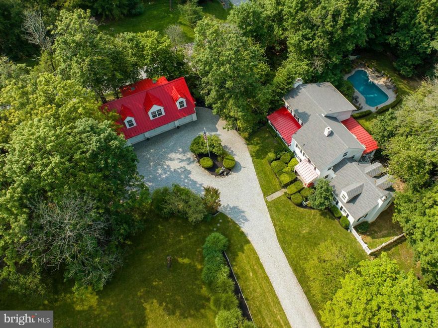 Tranquility awaits you at this quintessential, secluded 1865 renovated  farmhouse  nestled on 4.7 acres located  in Malvern and within the award winning Tredyffrin-Easttown school district.  Featuring 4 bedrooms, 3.5 baths.  BE SURE to check out the third floor Bedroom,  plus a 4-car detached garage complete with a 1 bedroom, 1 bath apartment/au pair/in-law-suite, Spacious, sun-drenched home features thoughtful, elegant and desirable touches.  This magnificent home is truly a one-of-a-kind gem, seamlessly blending modern amenities with historic charm and privacy.  This majestic  home boasts  a chef’s kitchen with top-tier stainless-steel appliances, Viking 6 burner gas stove, Jenn-Air double oven, Monogram refrigerator, gorgeous ceramic tile kitchen floor, huge farmer's sink, and entire first floor otherwise hardwood.  The house has two separate staircases, one leading to three bedrooms and the other to a private and separate en-suite perfect for a nanny or guests. The house is complete with four fireplaces. Primary bedroom with en-suite bath,  fireplace, leaded windows which lead you through French doors to a large sitting room overlooking the backyard pool and in the winter the view of Great Valley is absolutely spectacular, there is even a shaded fenced in area for fido.  The walkout basement is unfinished, perfect for storage.  An oasis of a front yard, perrenials  abound, backyard is designed with a summertime retreat in mind, featuring a 46-foot long covered porch overlooking a sprawling in-ground pool complete with pool house.   Enjoy sunny afternoons lounging by the sparkling pool perfect for entertaining and watching amazing sunsets offering the ideal space for creating unforgettable summer memories.  Car enthusiasts will appreciate that not only is there a detached 4-car garage, but above the 4-car garage is  a 1 bedroom, 1 bath apartment with kitchen and open-concept living.  This separate guest house is ideal for an au pair,   in-law retreat, or to host out of town guests.  Additional amenities include an automatic whole house generator.  The location makes for an easy commute to the Paoli Amtrak/Septa train station, Phila. Airport, PA Turnpike and downtown Wayne and Malvern with its amazing array of dining and shopping options. This location cannot be beat! Property Includes 2.2 Ac Wooded Charlestown Township.