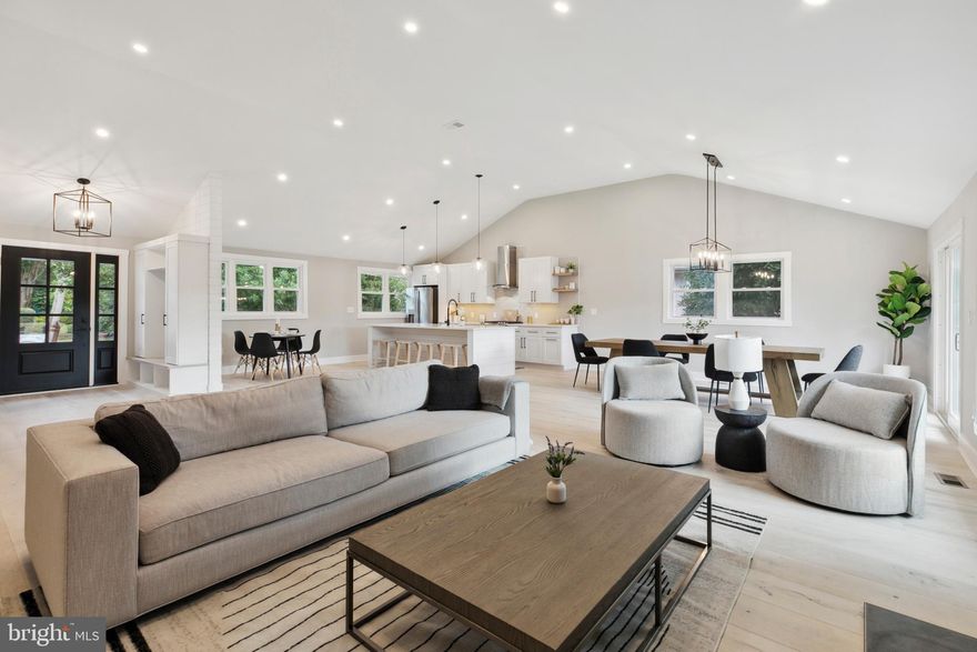 Welcome home to 522 N Wynnewood Avenue, an exquisitely renovated, 4 bedroom, 3.5 bathroom, 2,602 square foot home in Wynnewood, Lower Merion Township. Available for  a July move-in.  You are sure to be impressed as you enter into an open floor plan where modern elegance meets timeless comfort and vaulted ceilings help to create a  spacious living area. The living room offers pristine European Oak engineered hardwood flooring that flows seamlessly throughout the home. The focal point of the room is a fireplace with floor to ceiling shiplap and wood mantel. You’ll love cooking in this amazing kitchen boasting a large center island with seating and pendant lighting, white Shaker style cabinets, black matte hardware, quartz countertops, tile backsplash, gas cooking, range hood, and microwave. There’s even enough space for both a breakfast table and a formal dining table. Work from home? The breakfast area would also function well as an office or homework area. Sliding glass doors from the dining area lead to a flat backyard with room to play or let your four legged friends run. It is the perfect spot to grill and dine al fresco or enjoy a glass of wine after a long day. Back inside, a powder room conveniently completes the main level. Up a short flight of stairs, you will find the primary bedroom with custom California Closet built-ins, a private en-suite bathroom including a walk-in shower with tile surround, frameless glass door, a double vanity and beautiful tile flooring that extends up the walls. The second bedroom has a private en-suite with a stall shower. The additional two bedrooms share a full hall bathroom offering a tub/shower combination and tile flooring. A finished, daylight lower level provides additional living space and is ideal for a family room, in-home office, gym, play area and more. The laundry room with quartz countertop folding area and plenty of cabinet space is located on this level as well. Lastly, there is access to the one-car attached garage with additional storage. Location! Location! Location! This property is just steps away from Lower Merion High School, places of worship, shopping, dining, Narberth Park and public transportation providing easy access to Center City Philadelphia.