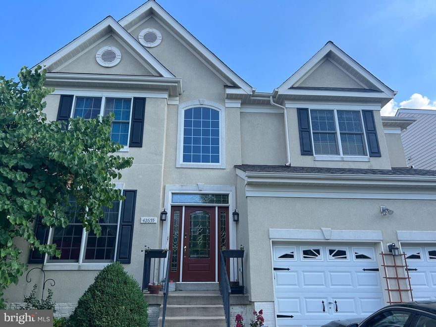 Welcome home to this beautiful Colonial Home, situated perfectly in the sought-after South Riding neighborhood. This house is truly amazing, boasting fresh paint throughout, a traditional floor plan that flows perfectly, a chef's kitchen, a huge yard, and so much more. Some of the amazing features are hardwood floors on the first floor, eat-in kitchen, a large fenced in yard, a huge primary bedroom with coffered ceiling and primary bath, and an oversized laundry room with new sink. There are 4 total bedrooms upstairs. The basement offers a large recreational area, walkup stairs, a full bathroom and a room that can be used as a 5th bedroom. It also is finished with a kitchenette. The house has a new roof, new washer and dryer, new HVAC, large deck  and fully fenced yard, and a two car garage. Homes like this rarely come for rent in such a prime location. Don't miss out on this beautiful home!!!!