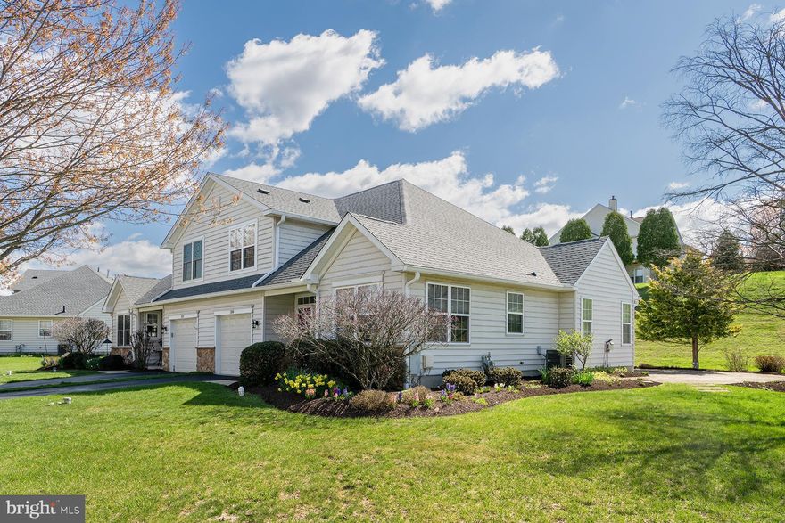 Welcome to 136  Haslan Lane, ideally situated within the highly desirable Villages at Hillview, an exclusive 55+ community . Set on a premium lot, this carriage home showcases a fresh neutral palette,hardwood flooring on the main level, and plush new carpeting on the stairs and second floor. Primary Suite and laundry on first floor.

Designed with both comfort and peace of mind in mind, the home features recently updated major systems, including a newer roof (2020), a brand-new HVAC system (2025), and a hot water heater (2023). The expansive great room serves as the heart of the home, anchored by a warm gas fireplace with a granite hearth, creating an inviting yet sophisticated gathering space.

The sunroom offers a serene retreat with new sliding doors that open to a private patio framed by lush landscaping and picturesque views—an ideal setting for morning coffee or evening relaxation.

The main-level primary suite provides a tranquil escape, complete with  an en-suite bath featuring a double vanity and a spacious walk-in closet. The upper level offers a private guest bedroom, full bath, and additional storage, perfect for accommodating visitors with ease.

Enjoy a lifestyle of effortless luxury with low-maintenance living and access to resort-style amenities, including swimming pools, a clubhouse, fitness center, tennis courts, scenic walking paths, and a vibrant calendar of social activities. Minutes from Route 30 East and West connecting Chester Co to Route 202 King of Prussia or the Lancaster County attractions