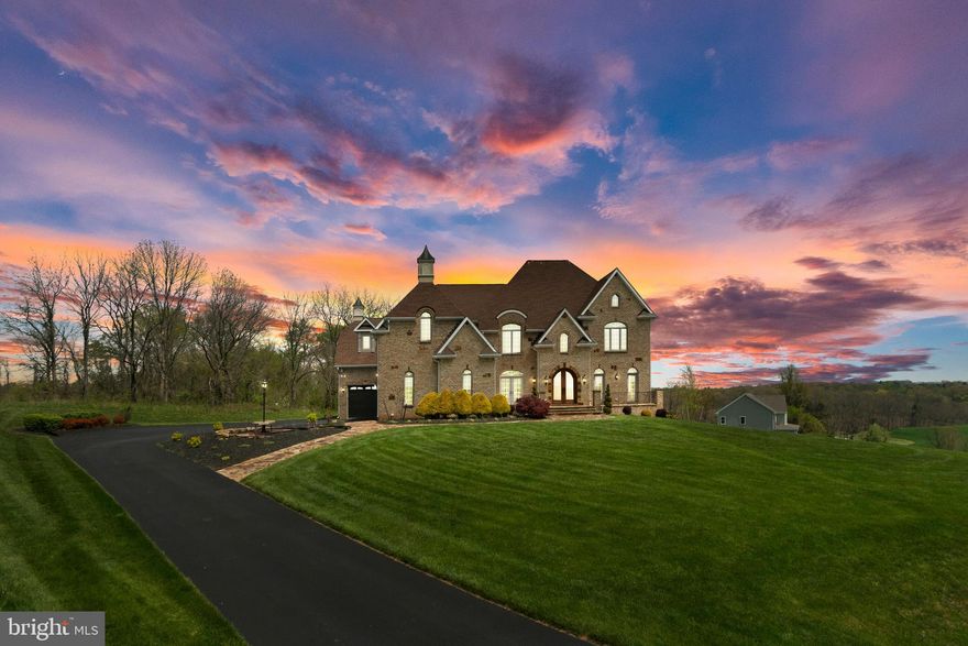 Dreams do come true! Exquisite, 5 BR, 4-1/2 Ba,  3-car garage,  custom built, all brick home  with all the bells and whistles, nestled on 2.19 acres.   Step into the dramatic 2-story entrance foyer with Italian  marble floors.  Main floor has formal Dining Room (mahogany wood floor), expansive  gourmet Kitchen (hardwood floors) with custom marble countertops, 8 burner stove, 2 ovens, freezer, over-sized refrigerator, bread oven, steamer, wine rack,  island,and so much more,  sunken Living Room (hardwood floor)  with fireplace and French door to stone patio, Family Room  (hardwood floor) w/fireplace, first floor Bedroom (hardwood floors )  w/full bath, Office  (hardwood floor), and powder room.  Upper level has  huge Master Bedroom  suite w/tray ceiling, gas fireplace, wet bar, sitting room, enormous walk-in closet with built-ins, luxurious  spa-like master bath w/ soaking tub, sep shower, double vanities..  Bedroom #2 has separate bathroom, walk-in closet and bonus area.  Buddy bath between Bedrooms 3 & 4.  Conveniently located laundry room w/sink on bedroom level.   Over 5200 sq ft of  living space  above grade.  Full, unfinished basement w/ fireplace.  Attention to detail, inside and out!  You will not be disappointed.  Perfect for entertaining with exquisite finishing touches throughout.  Lots of natural light.  Spectacular view of Carroll County countryside.