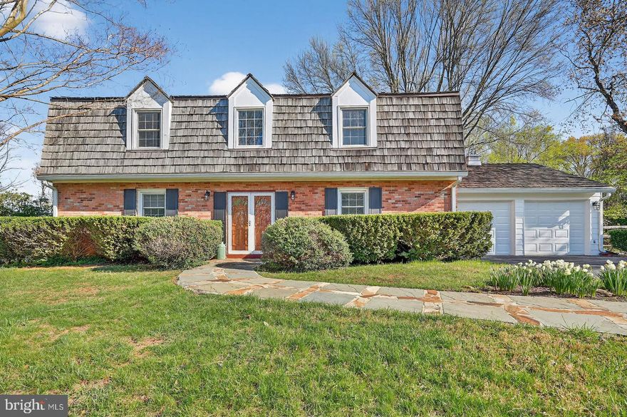 SOLID-BUILT COLONIAL in the much-sought-after neighborhood of  Williamsburg  Village , with a roadside lined with cherry trees, and situated on a level two-thirds-acre lot. The brick exterior embraces a ROOMY INTERIOR, with 4 bedrooms and 2-and-a-half bathrooms.  The home offers over 2600 square feet of finished area, which allows generous-sized rooms, including a stately 2-story entry foyer.  The longtime owner has taken very good care of the home - it is clean and well-maintained. There are replacement windows throughout. THE MAIN LEVEL has wood floors and some lovely chair rail and crown molding. The front foyer provides access to the stairway up to the 2nd floor or to all parts of the main level. There is a centrally-convenient powder room. To the left, one can enter through double-doors to the living room and can continue toward the back family room. The family room has a raised hearth with a wood-burning fireplace and brick surround. A sliding glass door leads directly to the backyard. Or one can proceed to the separate dining room that adjoins the kitchen with a breakfast tablespace area. Continuing to the right side of the home, there is a laundry room with washer, dryer, and double sink. The home's utilities are also in this room, as is a second refrigerator. Continuing beyond the laundry is access to the two-car garage and a rear bonus room with direct access to the outside - this room can serve many possible functions, such as for exercise, games, crafts, or storage. THE UPPER LEVEL features hardwood flooring throughout. The spacious primary bedroom has two double-wide walk-in closets with built-in shelving, a ceiling fan, and connects directly to the primary bathroom with a glass-enclosed tub-shower and a skylight. This bathroom also connects to a large office area - that COULD BE CONVERTED TO A FIFTH BEDROOM. Bedroom 2 also has a ceiling fan.  All four bedrooms have large closets. There is a second full bathroom on the upper level with a glass-enclosed tub-shower and a skylight. An attic is located above the upstairs hallway and offers additional storage space. THE FENCED BACKYARD is ready to host friends of all-ages. The yard lends itself to peacefully relaxing or to a variety of games and sports activities. The back of the house has a large screened porch with a ceilng fan and 4 skylights. Adjacent are a brick patio and a wooden ground-level deck with built-in benches. THE TWO-CAR GARAGE leads to driveway parking for 5 cars plus street parking. The back of the garage leads to a BONUS ROOM - with separate outside entry - great for storage or exercise room or games or hobbies - let your imagination proceed! The home is CLOSE TO ALL THE AMENITIESs of Olney (dining, shopping, Olney Theatre, sports, business & medial facilities, and is in close-proximity to popular public and private schools, as well as major communter routes, and the Glenmont metro is only four miles south. A GREAT PRICE FOR A GREAT COMMUNITY - HURRY - THIS WON'T LAST LONG!
