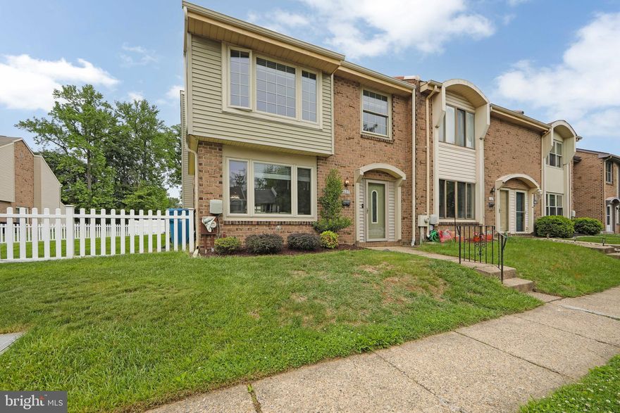 Welcome to this spacious end-unit townhome offering more square footage than most homes in the neighborhood along with an extra-large yard perfect for outdoor enjoyment. Step inside to a large formal living room that flows seamlessly into the formal dining area, creating an inviting layout ideal for everyday living and entertaining. The updated kitchen features newer cabinetry, granite countertops, and stainless steel appliances. Just off the kitchen is an expansive flex space that can easily serve as a generous eat-in area, family room, or combination of both with ample room for a kitchen table and island. The first floor also includes a convenient half bath and a spacious laundry room. Upstairs, the massive primary bedroom offers a large walk-in closet and enough space to potentially add an ensuite bathroom if desired. Two additional bedrooms and a large full hall bath with linen closet complete the second floor. A pull-down attic provides abundant additional storage space. Outside, enjoy a wood deck overlooking the oversized fenced yard with charming white vinyl picket fencing — perfect for entertaining, gardening, or simply relaxing outdoors. Move-in ready and full of potential, this home is ready for its next owner. Welcome home!