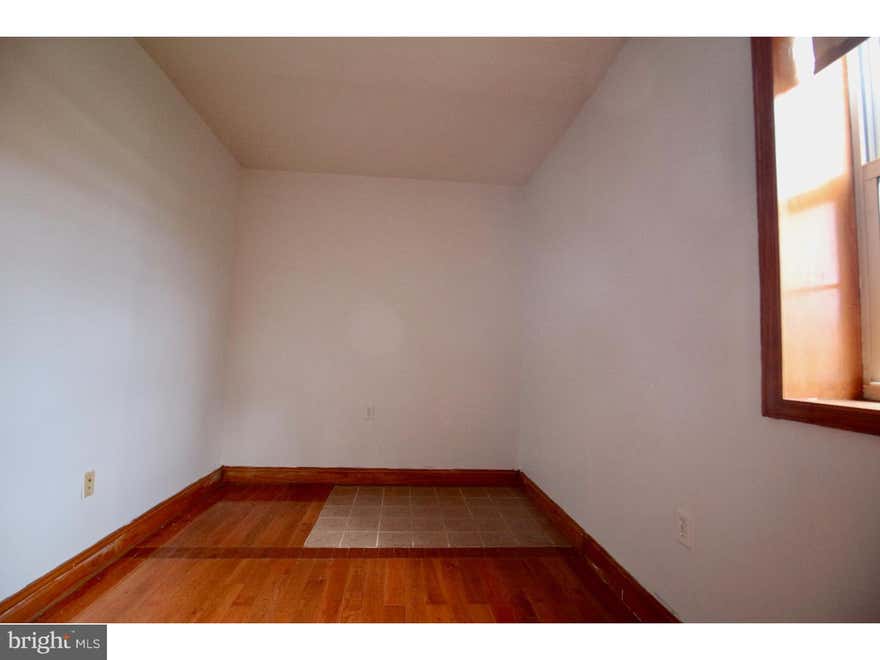 Available now- third floor walk up one bedroom apartment. Enter the apartment and the first room is to your right, could be bedroom or living room. Continue to the middle of the apartment and into the kitchen which has granite counters and brand new stainless steel appliances. The bathroom is off of the kitchen and the second and large room is at the front. The front room over looks Girard avenue. Central heating and cooling system, coin operated laundry is available in the basement.