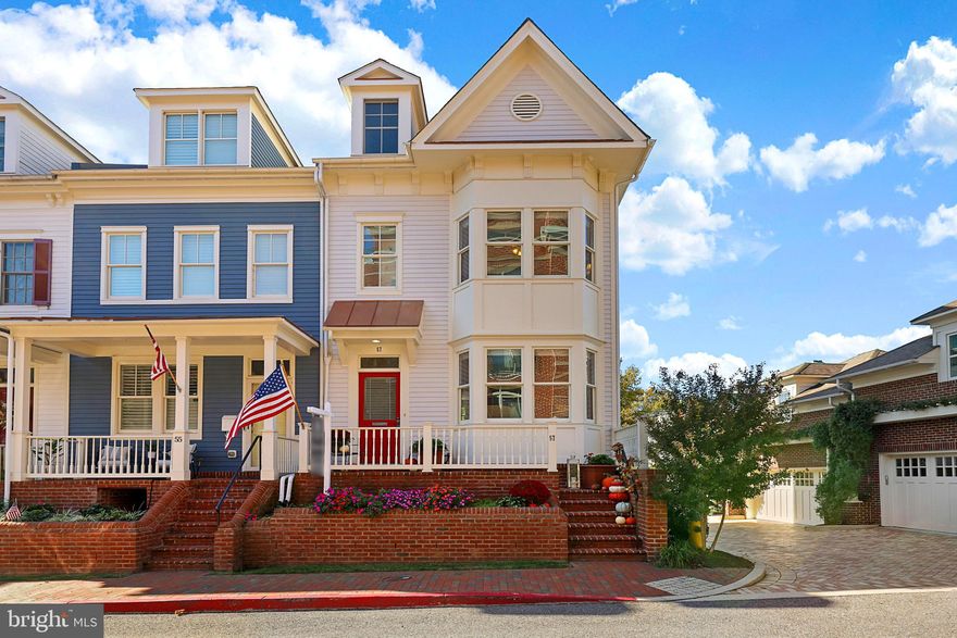 This stunning 2007 home in the prized community of Acton’s Landing, combines all the amenities of modern living with the beauty and charm of historic downtown Annapolis.  A short walk to Main Street lets you explore the restaurants, shops, and sights before returning to what feels like your private country oasis!  This rarely available end unit townhome on Richard’s Lane was the original show home for Acton’s Landing.  With finishes of the highest quality, the home never required updates.
 
Enter the main level Living and Dining areas boasting 9ft high ceilings, crown molding, new neutral paint, gleaming hardwood floors throughout,  gourmet Kitchen with a granite island, custom built-in cabinetry, and top of the line stainless steel appliances all overlooking a sun filled rear deck and beautifully landscaped common area. The large open plan Living, Dining, Kitchen and deck areas offer a perfect setting for entertaining. 

The hardwood staircase to the second level leads to the Primary Bedroom with his/her custom closets and a stunning Primary Bath featuring a walk-in shower and soaking tub. The second level also features a convenient laundry closet and large second sunny bedroom and with ensuite bath.

Head to the upper level, which provides guest quarters for your adopted "Mid" from the Naval academy.  It features vaulted ceilings, French doors, a full bathroom, and plenty of space for an office or exercise area leading to a deck featuring glimpses of Spa Creek. 

The lower level features a fourth bedroom, or entertainment room. It has a full bathroom and direct access to the attached two-car garage that leads out to a beautiful landscape.  Upgrades include fresh paint in 2023, new water heater, 2 zone heating & AC. The popular waterfront park Acton Cove on Spa Creek offering public access for kayaks is just a short walk away.  For a longer stroll, head for the City Dock, Choptank Restaurant on the water, or the Naval Academy for a tour.  Welcome home! Your Acton’s Landing Lock and Leave dream has come true!