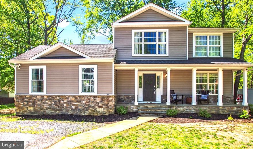 Tucked away on a quiet corner lot in the sought-after, water-privileged community of Glebe Heights, this  updated 4-bedroom, 3.5-bath Colonial is the perfect blend of timeless charm, modern comfort, and South River-Chesapeake coastal living. Step inside to a light-filled layout featuring warm wood floors, neutral designer tones, and an effortless flow ideal for both daily living and entertaining. The main level impresses with a spacious living area and an eat-in kitchen that opens to a formal dining room, complete with tray ceiling, elegant crown molding, and classic craftsman-style wainscoting.  A rare main-level suite with soaring vaulted ceilings offers versatility as a primary bedroom with a full bathroom, guest quarters, or second family room. Upstairs, you’ll find a second primary suite with vaulted ceilings and a private en suite bath, plus two additional generously sized bedrooms—each enhanced with recessed lighting, custom craftsman woodwork, and soaring ceilings. Another updated, spa-inspired full bath completes the upper level.  Need more room to spread out? The fully finished basement with its own private entrance offers a flexible layout featuring a rec room with recessed lighting, dedicated office space, ample storage, and a convenient mudroom-style entry perfect for managing all your outdoor gear. Start your mornings on the welcoming front porch, and end your days entertaining on one of the two back decks overlooking the yard. And when you’re ready to hit the water, you’re just a short stroll to the community’s private pier and beach—ideal for kayaking, paddle boarding, or simply enjoying the Bay breeze.