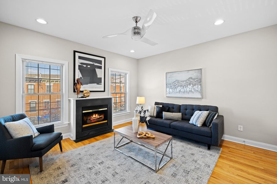 This stunning, turnkey rowhome seamlessly blends modern upgrades with timeless charm. Gleaming hardwood floors span the open living space, where crown molding and a cozy gas fireplace create a warm, inviting atmosphere. The formal dining room, also accented with crown molding, flows effortlessly into the upgraded kitchen, featuring rich wood cabinetry, granite countertops, and stainless steel appliances. Step out onto the private deck off the kitchen, perfect for outdoor dining or relaxing.
Upstairs, you’ll find two generously sized bedrooms and two full baths, including a luxurious owner’s suite complete with custom closet cabinetry and an ensuite bathroom. The lower level offers added versatility with a third bedroom, a third full bath, and walkout access to a private brick patio. It also connects to the rare attached 1-car garage.
This home’s unbeatable location offers easy access to Schuylkill River Park, perfect for biking, jogging, or serene riverside strolls. It’s also within walking distance of Fitler Square and some of the city's top-rated restaurants and cafes, providing endless options for dining and socializing. Conveniently situated near the Schuylkill River Trail, public transit, South Street Bridge, and UPenn, this home combines urban living with neighborhood charm.