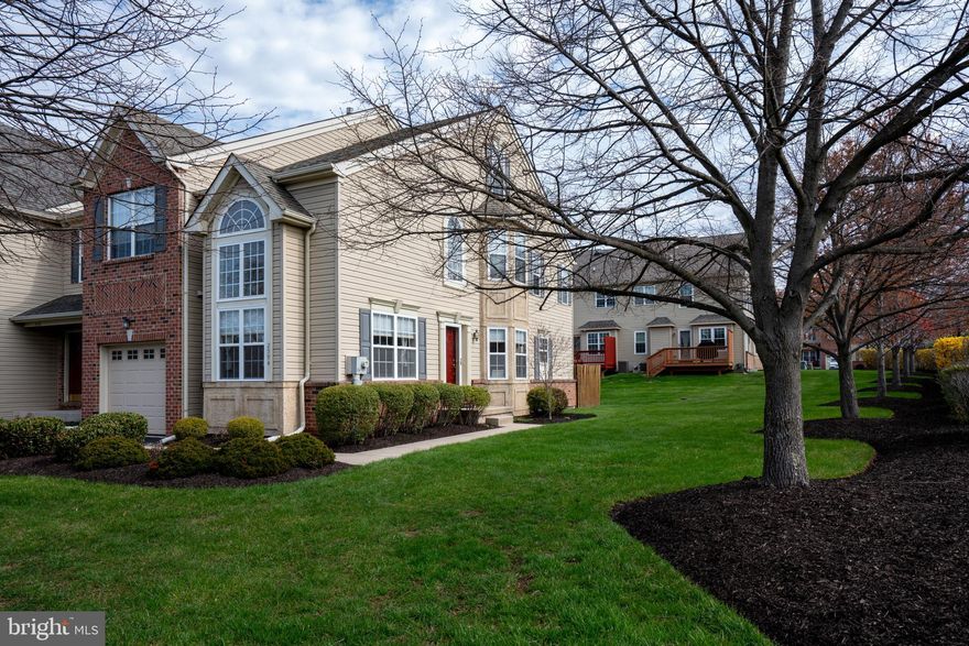 Welcome home to this very well-maintained end unit townhome in the quiet and desirable Wellington Village community. This home features 2,313 sq ft with 3 bedrooms, 2.5 bathrooms, a 3rd floor office, and an additional 550 sq ft in the finished basement.  This home has attractive brick detail on the garage side of the home with stucco decorative elements beneath the Living Room windows and the double bay windows.  Enter the foyer into the open Living and Dining Rooms with hardwood flooring throughout the first floor. The back of the home has the Family Room/Kitchen combo with a large kitchen island, an abundance of storage in the cabinets and pantry. Exit the full panel glass door to the outside patio. Upstairs are three bedrooms, the primary with its own bathroom and walk-in closet, two additional bedrooms share the hall bathroom, and there is conveniently located laundry room. Upstairs on the 3rd floor is an office with skylights for additional natural daylight. Downstairs is a finished recreational room, and a separate unfinished area being used as a gym. This home is nicely positioned in the neighborhood with shade trees and bushes that add to the homes’ privacy. There’s easy maintenance living in this neighborhood with the HOA taking care of the lawn, snow, common area maintenance and trash removal. Great location and within walking distance to Landis, Telford Park, and Indian Valley Library, close to Rt 309 and Rt 113.