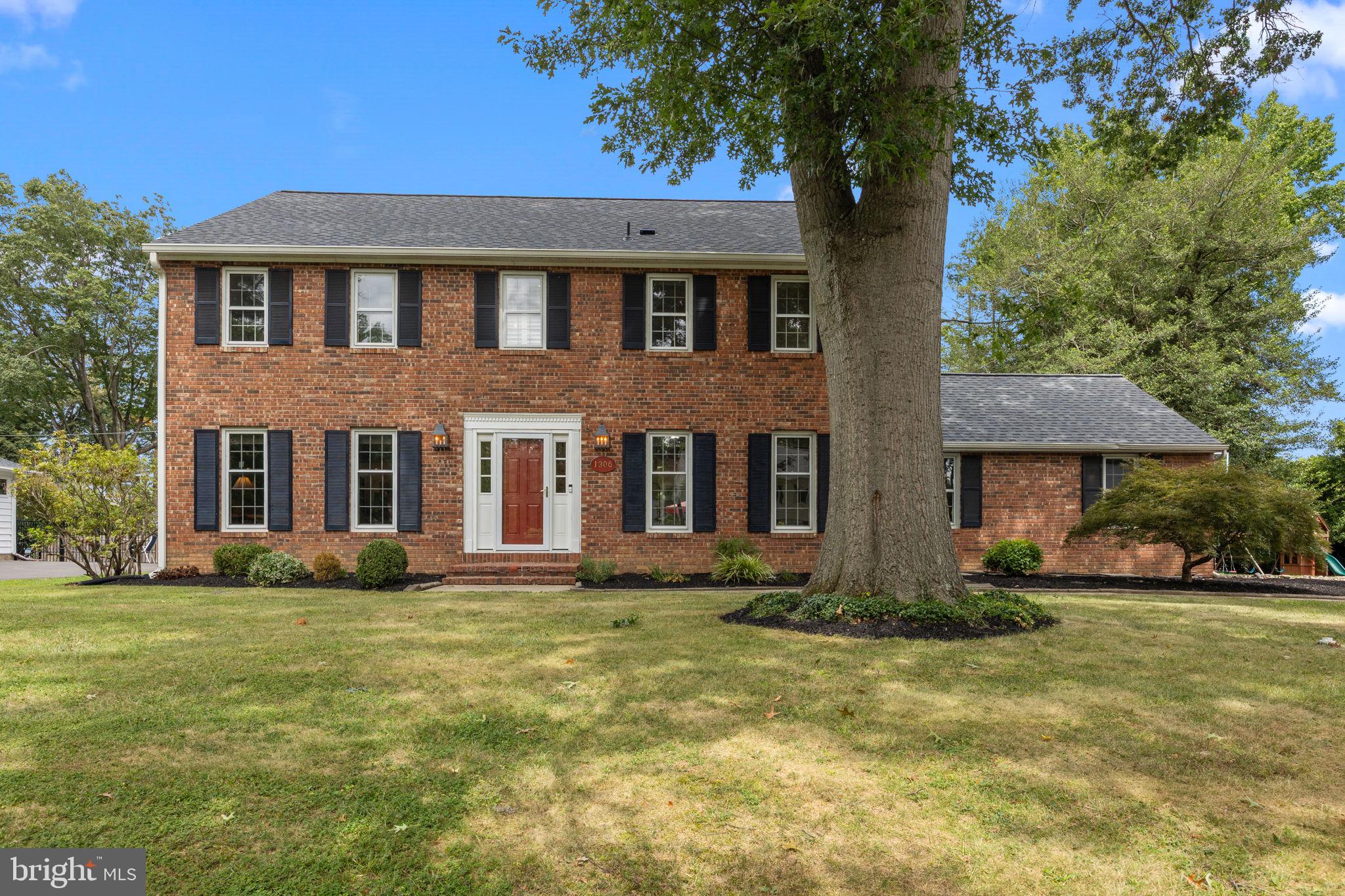 Welcome home to this stately brick-front Colonial in the sought after neighborhood of Old Wynnewood, where timeless elegance meets modern comfort. Step into the spacious foyer where gleaming hardwood floors flow seamlessly throughout and custom millwork adds refined character to every room. The heart of the home is the fully renovated gourmet kitchen, showcasing gray soft-close cabinetry including a glass-front corner cabinet with interior lighting, Quartzite countertops, a peninsula with seating, a stainless steel farmhouse sink and a classic subway tile backsplash. Top-of-the-line stainless steel appliances include a Jenn Air professional six-burner gas range with a dual gas/convection oven, making it a chef’s dream. Adjoining the kitchen, the sun-filled breakfast room boasts a vaulted ceiling with two new skylights. A Pella triple sliding French door topped by a striking half moon window leads to an expansive paver patio perfect for hours of outdoor entertaining. The inviting great room features a wood-burning fireplace with a handsome wood mantle, flanked by custom built-ins, and a vaulted ceiling with two new skylights equipped with solar-powered Velux retractable shades. A wall of floor to ceiling Pella windows allows the natural light to flood the room and offers serene views of the lush backyard and direct patio access. Elegant French doors open to the spacious living room, while the formal dining room charms with a built-in corner cabinet and petite French doors connecting to the kitchen. A well-appointed laundry room with stacked washer/dryer and wash sink, along with an updated powder room, complete the main level. Upstairs, the serene primary suite offers two large double closets and a beautifully updated bath featuring marble tile flooring, a double vanity with quartz countertop, and a soaking tub/shower surrounded by classic subway tile. Three additional generously sized bedrooms with ample closet space share a pristine hall bath with a double vanity. Located within the highly regarded Pennsbury School District and just minutes to restaurants, shopping, and public transportation to New York City and Philadelphia, this home blends sophistication, comfort, and convenience in one exceptional package.
**New roof and new siding (July/August 2025)**