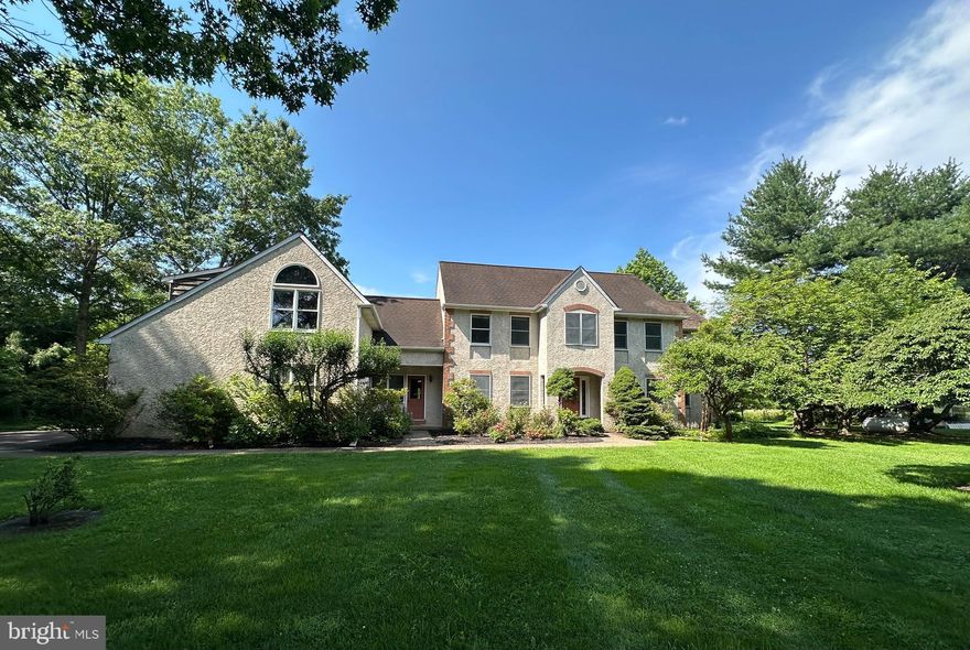 First Time on the Market – Custom-Built 1988 Home on Rare 12.35 acres!
Welcome to 1432 Holicong Rd, where lush grass and a tree-lined driveway lead you to an expansive 4,700 sq. ft. home in one of the most desirable locations in Bucks County. Featuring 5 bedrooms and 3.5 baths, offering endless possibilities to create your dream home. Ideally situated just 3.5 miles from the charm of Peddler’s Village, 6 miles from the vibrant arts scene of New Hope, 7 miles from historic Doylestown, and only 74 miles from New York City, this property combines serene living with easy access to dynamic destinations.
The main level includes a first-floor primary suite with a fireplace and a sitting area that overlook the expansive yard. Also on the main level are an eat-in kitchen with a center island, two dens, a solarium, a living room with cathedral ceilings and a fireplace, a mudroom, half bath, and a laundry room, with multiple access points to the patio and gardens—perfect for family gatherings and entertaining.
Two staircases lead to the upper level, where you'll find 4 additional bedrooms and 2 full baths. One bedroom includes its own bath and has a private staircase to the first floor, offering a flexible and unique living arrangement.
Above the garage, a beautiful, bright, unfinished bonus room awaits—offering endless potential for a home office, artist’s studio, or creative retreat. The basement boasts high ceilings, exterior access, abundant storage, and room to expand.
The outdoor space is equally remarkable, with a 20 x 28 detached greenhouse—formerly home to award-winning orchids—ideal for avid gardeners. This property also features energy-efficient geothermal heating and solar backup electricity, fully owned, along with a central vacuum system.
Whether you're hosting gatherings in the expansive backyard, enjoying peaceful mornings in the solarium, or envisioning future possibilities to subdivide, this property is a rare gem ready to be reimagined.