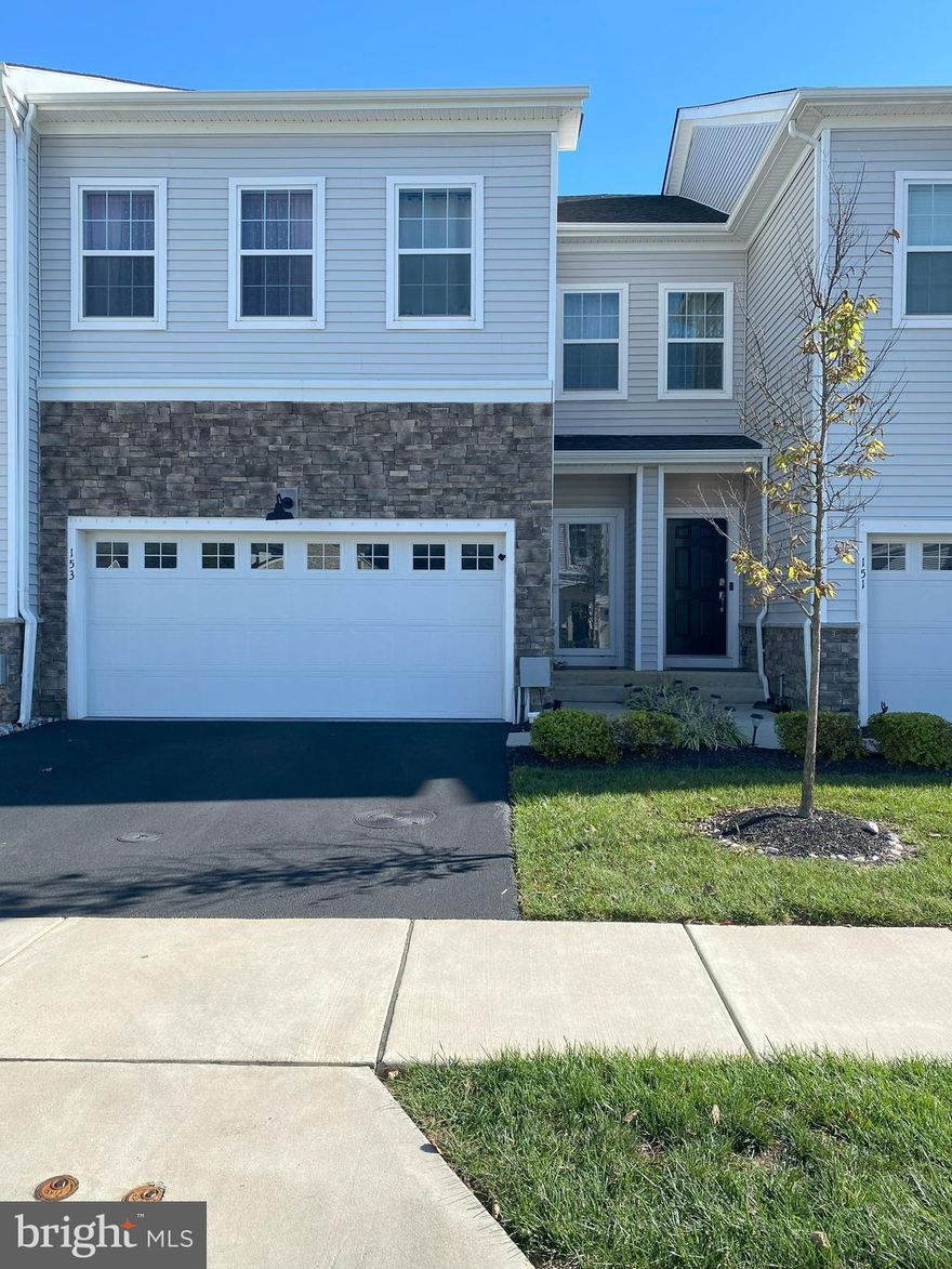 TThe Annabelle model townhome, built in 2021 within the Lochiel Farms community, offers a spacious 2,940 square feet of living space, blending modern design with advanced technology. Of this space, 2,340 square feet are above ground, while the remaining 600 square feet consist of an finished basement. This elegant home features 3 bedrooms, 2 full baths, 2 half baths, and a two-car garage, enhanced with epoxy flooring and premium overhead storage.

Upon entering, a welcoming foyer leads you down the hall to a convenient half bath and into the open-concept main living area. The highlight is the gourmet kitchen, which features a large quartz island, a built-in oven and microwave, and a walk-in pantry for ample storage. The kitchen seamlessly flows into the living room, dining area, and sitting space, where a gas fireplace, complete with remote control, adds warmth and ambiance. Sliding glass doors open to a Trex deck, perfect for outdoor entertaining or relaxation.

The home is equipped with state-of-the-art smart technology, including a Ruckus Mesh Wi-Fi system with multiple access points, Ring Video Doorbells, and smart LED lighting throughout. In the main living space, remote-controlled automatic blinds offer convenience

Upstairs, a versatile loft area doubles as a sitting room or home office. The primary suite is expansive, featuring two walk-in closets, a private sitting area, and an en-suite bathroom with double sinks, a shower stall, and a private commode. Two additional bedrooms, each with walk-in closets, share a full bathroom on this level. The second-floor laundry room provides easy access, adding to the home's convenience.

In the basement, a custom-designed dry bar with white cabinetry and a quartz countertop sets the stage for entertaining. while a premium Sonance 5.1.2 Dolby Atmos surround sound system, paired with a Sony 7.2 channel receiver, elevates the entertainment experience.

The townhome is ideally located with walking access to the Chester Valley Trail and East Whiteland Park, and it is close to major shopping centers and train stations. Commuting to Philadelphia, Malvern, King of Prussia, and Exton is quick and convenient, making this residence a perfect blend of luxury, technology, and practicality in a highly sought-after location.
