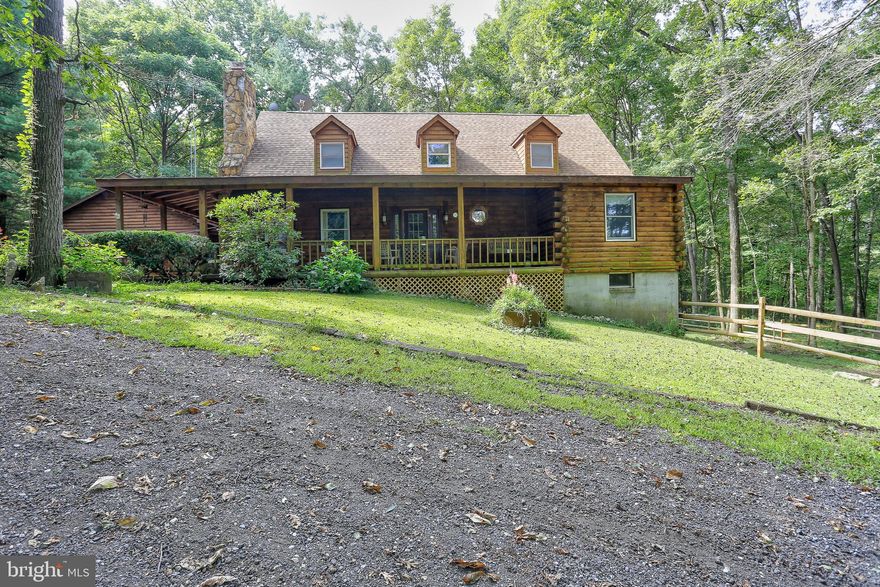 Perfect property layout makes coming home feel like a world away. Custom built charming log cabin. Huge room sizes, beautiful hardwoods, freshly painted and move in read. Two stall barn and outdoor sand stone ring. Two garages, the second built for a lift, plenty of parking. Possible first floor master, office, wood floors. Wood stove in family room. Wrap around porch overlooking property. Quiet country living minutes to modern conveniences. Conveyed as-is.