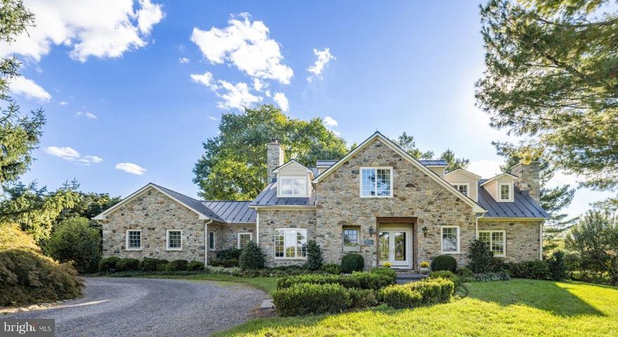 Stunning!!! Harborvale is a beautiful 51-acre estate, 5 minutes from historic Middleburg. The gated entry opens into a long, straight drive through an allee of vibrant trees, which leads to the stunning home. The drive then continues to the 3-car garage, the 5-stall stable and the 3-bedroom tenant house.  Beautifully sited, the land surrounding the home is gently rolling and mostly open with gorgeous gardens, pastureland, fenced paddocks, and a spring-fed pond. Three automatic generators service this property’s home, tenant house and stable.
Built in 2017 by the current owners, the previous home was taken down to the foundation leaving only the stone fireplace in the family room. The mortar from the previous exterior’s stones was removed and the stones were used to build the current home. The original hearth stone is now the step at the entrance.
Heavy oak doors open into a covered entry of the home providing comfort for one’s guests. Upon entering the foyer, one realizes that this home was built to showcase the tremendous light and views. To the right is an exquisite private suite with anteroom, which opens to the library with a wood burning fireplace and a full bath. To the left of the foyer is the elegant formal living room also with a wood burning fireplace. Returning to the foyer, the gleaming floors lead straight through the bar area into the light filled sunroom. The bar area features natural cherry cabinetry, access to the elevator, and a door leading to the basement.  In the sunroom, one realizes how ideal this home is for elegant, as well as casual entertaining. Four sets of French doors provide tremendous light and open out to the terrace and stunning gardens of perennials, flowering and fruit trees. The sunroom is also adjacent to the grand dining room. At one end of the dining room, handsome, built-in cabinetry flank the French doors which open into the formal living room. At the other end of the dining room is a large walk-in bay window, which brings in the natural light. Beyond the dining room one enters the spacious family room/kitchen and breakfast room. 
The family room features the original stone fireplace and a vaulted ceiling. It is completely open to the large breakfast area and the kitchen. Beyond the kitchen is the laundry room, mud room and a powder room.
Returning to the foyer, wide steps lead to the upper-level hallway. The hallway provides access to the primary suite, 3 additional bedrooms, a hall bath, and a laundry closet which houses a stacking washer and dryer.  The exquisite primary suite offers tremendous privacy, and features an elevator, breakfast bar, sleeping room, sitting room with gas fireplace and balcony, and 2 full baths. The second bedroom features a private bath and a balcony. The 2 additional bedrooms are very charming and share a hall bath.  
Located in prime Orange County Hunt Territory, this estate has hosted Hunt Meets. The horse facilities include a new stable with 5 stalls, a washroom, tack & feed room and a hayloft. In addition to the stable there is a riding ring, 2 – 5 acre fenced fields with run-in shed, one small field, one round pen and a mowed bridle path around the property. 
The 51-acre estate of Harborvale is within 5 minutes of the historic town of Middleburg on a very quiet lane with only 6 other estates. The land is currently in Open Space Land Use through 2027 and is mostly surrounded by estates protected by Conservation Easements. This is a tremendous location, convenient to town and very private.