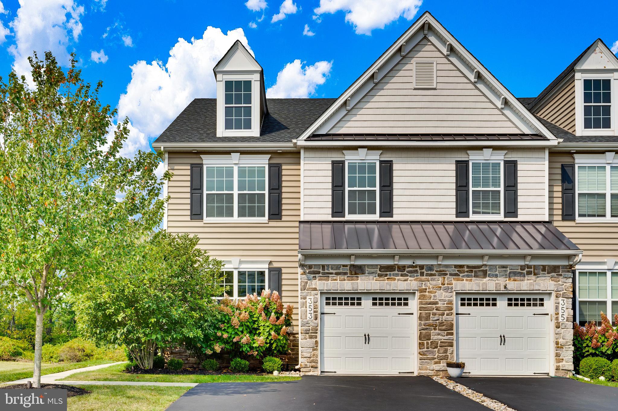 Welcome to this totally upgraded Rittenhouse Model Carriage home in the desirable Colebrook community of New Britain Township. Built by WB Homes, this home is located in the Central Bucks School District. This three-bedroom, three-and-a-half bath residence combines timeless design with modern luxury.
The first floor offers nine-foot ceilings and open, sun-filled living spaces with engineered hardwood flooring throughout the dining area, family room and flex room. The family room features a floor-to-ceiling stone gas fireplace leading into the sun room with its cathedral ceiling. Sliding glass doors leading to a rear second level deck. The gourmet kitchen is a true centerpiece, featuring quartz countertops, a tile backsplash, an enlarged center island with pendant lighting and breakfast bar, stainless steel six-burner gas range, stainless dishwasher, microwave, refrigerator, under-cabinet lighting, and a single-bowl sink with disposal. A powder room with pedestal sink completes the first floor.
The staircase leads to a hardwood second-floor landing. The master bedroom suite features a cathedral ceiling with architectural molding, built-in speakers, upgraded carpet, and double walk-in closets. The luxurious master bath offers heated tile floors, a vaulted ceiling, double sinks with a quartz countertop, a tile wall which continues into a beautifully tiled stall shower with a stone tile floor. Two additional bedrooms with recessed lighting and wall-to-wall carpet share a fully updated hall bath with heated tile floor and a granite vanity. A convenient laundry room with washer, dryer, and extra cabinetry is also located on the second floor.
The finished walkout basement expands the downstairs living space with a recreation area featuring wall-to-wall carpet, two large windows, and sliding glass doors to a covered patio. A workout room with vinyl flooring, a full bath with heated tile floor and tile tub/shower, and a separate storage room complete the lower level.
Additional highlights include Sonos Sound System throughout, a one-car garage with storage mounted to the ceiling, wall shelving and storage, stone and vinyl siding, Trex deck, and a covered rear finished patio overlooking a private, landscaped rear yard with professional landscaping and exterior lighting