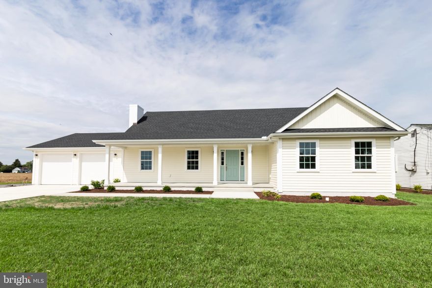 Welcome to this beautifully reimagined 4-bedroom, 3.5-bath home, newly renovated down to the studs with modern design and thoughtful finishes throughout.  Step inside to discover a gourmet kitchen featuring quartz countertops, premium cabinetry, stainless steel appliances, an oversized island, and built in wet bar. The open-concept kitchen and living area, create one spacious, light-filled great room. Off of the living room, the first-floor primary suite boasts a spacious walk-in closet and stunning en-suite bath with a soaking tub, walk-in shower, and dual vanities. An additional bedroom and full bath on the main level offer flexibility for guests or a home office. Upstairs, you'll find two generously sized bedrooms as well as a storage/utility room. Additional highlights include a convenient laundry room, sun room, a 2-car garage, and a prime corner lot location.