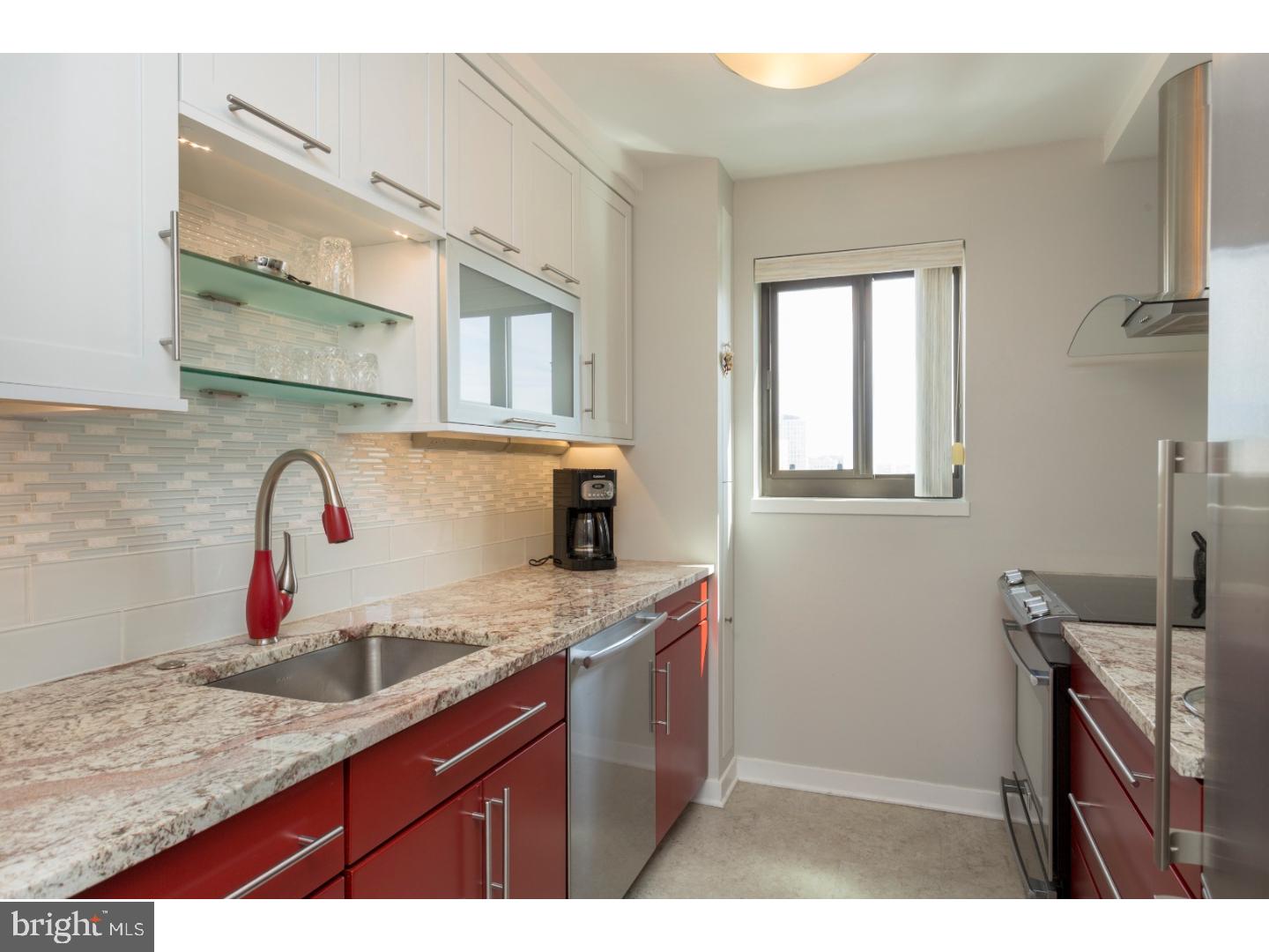 Enjoy incredible city views for miles and tremendous sunlight from this high floor 1 bedroom, 1 bath corner condominium for rent in the desirable Academy House. Not one detail was spared in this impeccable renovation. Enter into a foyer with a coat closet and a built-in bar area with glass shelving and LED lights, and a mini refrigerator. The flooring is Amalfi Grey & Metropolis Oak COREtec-Plus plank tile floors with cork for a comfortable feel. The kitchen is unparalleled to most - drenched with sunlight and offering a modern sleek feel, paired with the utmost functionality. Dressed with stainless steel appliances including Frigidaire Professional series glass-top slide-in range with convection oven, dishwasher, Kenmore curved glass range hood, cabinet depth Summit refrigerator, Montecarlo seamless granite counters, a custom above-range spice, Kraftmaid utensil cabinet and glass shelf, two-toned Kraftmaid soft-close cabinetry, lift and bi-fold doors and white bliss tile backsplash. Additional features include customized storage for all your pots and pans, cutting boards, and cookbooks as well as under-mount cabinetry lights and outlets. The bedroom offers a large walk-in closet and hanging closet. The fully renovated bathroom features a tile shower, Italian porcelain tiles of Calcutta Pearl, Ronbow vanity with soft-close frosted glass doors, a Robern medicine cabinet, recessed lighting, extra-large cabinetry for linens, and a washer/dryer. The Academy House offers a modern new lobby and luxury amenities, which are currently being renovated. Self parking is available to Academy House residents in the garage directly across the street for only $210 per month or valet parking is available in the building's garage for $300 per month. Located in the heart of Center City, with exciting day and night life at your fingertips... enjoy short walks to the Kimmel Center, Rittenhouse Square, restaurants, shops, cafes, transportation and more! Rent includes ALL utilities.