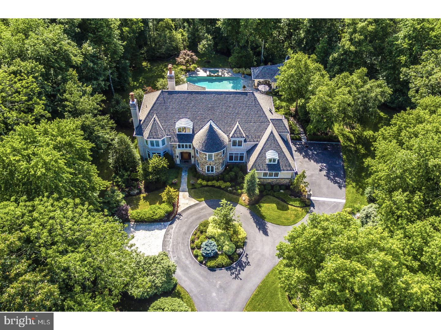 Exquisite 6,314 sq. ft. 5 Bedroom Custom French Manor Home, built by Guidi Homes, with superior attention to every detail, impressively situated at the end of a cul-de-sac, within Gwynedd Valley's highly desirable "Polo Club," with stunning updates & amenities throughout and featuring breathtaking, magnificently landscaped rear grounds surrounding the heated Pool, Hot Tub and magnificent Pool House, backing to Horse Trails. A circular drive w/lighted stone piers provides the welcoming entrance to the covered flagstone front porch. The 2-story Center Hall with marble floor and solid mahogany front door opens to the Living Room with 1st of 3 fireplaces & Dining Room, both w/hardwood floors & custom millwork. A chef's Dream Kitchen offers a radiant heated, tiled floor, granite counters, center island, Bosch 5-burner gas stove, 2 Bosch dishwashers, instant hot, tiled backsplash, double wall ovens, desk & more. A Butler's Pantry w/tumbled-marble counter connects the Dining Room & Kitchen. The Kitchen opens to the stunning Family Room featuring custom tiger-maple cabinetry w/wet bar & 2nd FP. An Office includes custom bookshelves, and a 1st Floor Gym could also serve as a 2nd Office. 2 Powder Rooms & a Mud/Laundry Room w/included washer, dryer, refrigerator & cubbies completes the 1st Floor. The gorgeous Master Bedroom features a tray ceiling, 3rd fireplace, & Dressing Area w/impressive professionally organized walk-in closet. The updated, spa-like Master Bath includes a radiant heated marble floor, marble counters, Kohler whirlpool tub & steam shower w/glass block wall & frameless glass door. The 4 additional bedrooms share 2 Jack and Jill Baths, and a 2nd Laundry Room includes 2nd washer & dryer. The 2nd floor also provides a walk-in cedar closet and stairs to an unfinished 3rd floor attic. The resort-like rear grounds feature an elegant flagstone Patio w/built-in gas barbecue overlooking the "salt to chlorine" Pool & Hot Tub. Entertain in the exciting, fully appointed Pool House w/vaulted ceiling, kitchen with granite counters, Full Bath & covered porch. Other excellent features include a 50-year roof, continuously recirculating hot water thru-out, 4 zones of HVAC, Central Vac, Security System & speakers in most rooms & exterior. Excellent Wissahickon School District was recently rated 10th in the state. Close to train station, major routes, excellent shopping & restaurants. 1 Year Home Warranty. This home is perfect for Entertaining or Personal Pleasure!