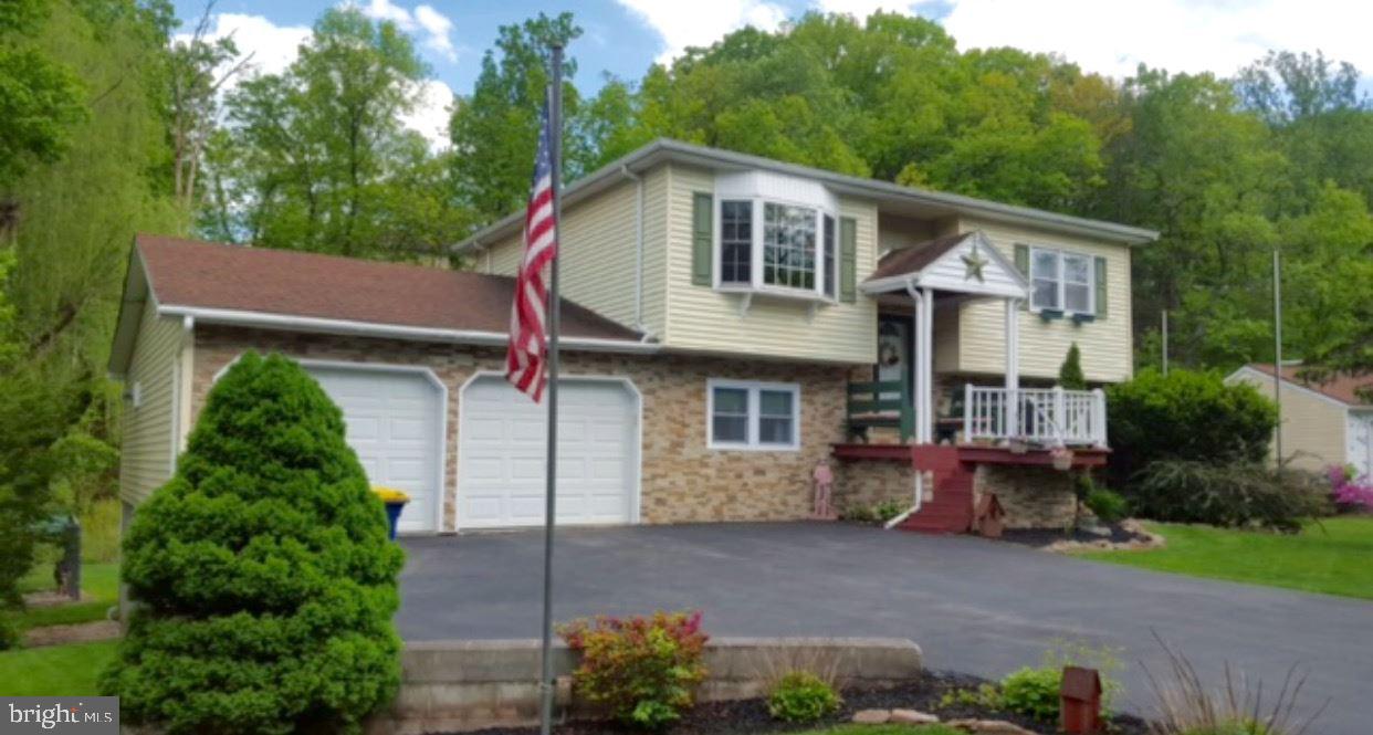 OPEN SUNDAY - FATHER'S DAY - 1 TO 3! Enjoy the Beauty and Comfort of this Tastefully Remodeled Single Family Home, Nestled in a Creekfront Setting, on a Large 1/2 Acre Lot with a Pleasant Wooded View! 3 Bedrooms, including a Ground Floor Master Bedroom, 2 Full Baths, Oversized 2-Car Garage, and 3 Entertainment / Recreation Areas! You'll enjoy overlooking the Creek from your Enclosed Rear Bar Patio and Deck, or listen to the Babbling Waters from the Back Yard Fire Pit! Tastefully Finished Throughout!