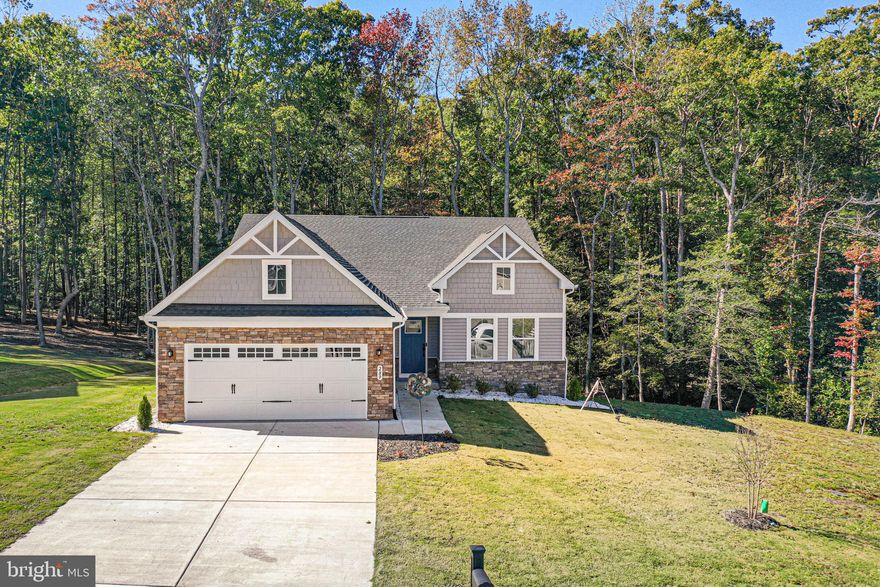 Welcome to 289 Pleasants Lane in the highly sought-after Grace Hill community of Kilmarnock, Virginia. This nearly new, one-owner home—just a year old—offers the perfect blend of modern design, quality construction, and a prime location just minutes from shopping, restaurants, medical facilities, marinas, and all the amenities the area is known for. The home features three spacious bedrooms and three full baths, an open floor plan filled with natural light, and a seamless flow between the living, dining, and kitchen areas, ideal for both entertaining and everyday comfort. A large composite deck spans the back of the home, overlooking a peaceful stretch of forest that provides privacy and a beautiful natural backdrop. The walkout lower level offers a generous rec room, a full bath, and an expansive storage area within the mechanical room, giving you flexible space for hobbies, guests, or a home gym. With public water and sewer, low maintenance features, and a location in one of Kilmarnock’s most desirable new neighborhoods, this home offers the best of convenience, quality, and style. Grace Hill is an established enclave of attractive newer homes with open surroundings and easy access to town, making 289 Pleasants Lane an exceptional opportunity to own a nearly new property that feels peaceful yet perfectly connected to everything the Northern Neck has to offer.