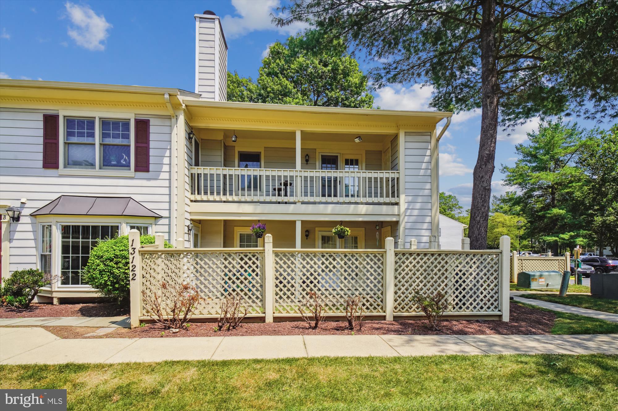 MUST SEE - light and bright, two-bedroom, two full bath condo, in the desirable “Waters House” condominium community. Surrounded by tall, shady trees, this gorgeous lower level unit features 934+ square feet of living space, an excellent floor plan, Thompson Creek double-pane windows and has many recent upgrades. A fenced-in porch/patio with garden space leads to the brand new storm door. Once inside, the home has been freshly painted throughout and includes luxury vinyl plank flooring, new appliances, ample closet space and lots of natural light. The large, open living room/dining room combo features recessed lighting, an oversize bay window with drapes and curtain rod that convey, a wood-burning fireplace with custom tile and wood mantle and built-in shelves with cabinet space. The dining room has colorful accent walls, custom wallpaper and updated lighting. The kitchen showcases granite countertops with lots of space, freshly-painted, bright white cabinetry, brand-new stainless-steel appliances - including a refrigerator, stove, dishwasher and built-in microwave and a breakfast bar with barstool seating. The large primary suite has a spacious walk-in closet with shelving and organizers, a ceiling fan with light fixture and direct access to the porch/patio area. It also has a bathroom with plank ceramic tile flooring, a large vanity and medicine cabinet, updated lighting and a tile-surround tub/shower with a decorative tile border. The second freshly painted bedroom has updated lighting, a wide closet and an across-the-hall bathroom with plank ceramic tile flooring, updated vanity with brushed nickel fixtures and a tile-surround shower stall. The unit also comes with a full-sized, stackable Washer/Dryer, a newer hot water heater, an exterior storage room and a large open parking lot with plenty of spaces. Enjoy all the nearby amenities including a community outdoor pool, restaurants, bars, shopping, tennis courts, parks, walking trails and more! Centrally located between DC/Baltimore/Frederick and close to major thoroughfares, this beautiful and affordable home has it all!
