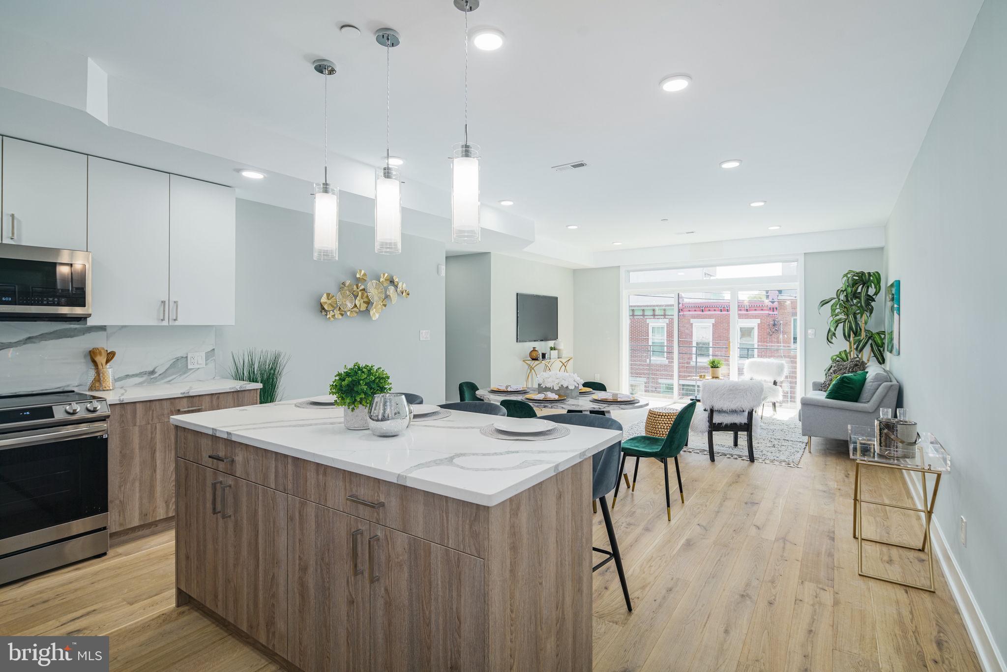 **LIMITED TIME special builder buydown financing available at @ 4.99% interest + $5,000 closing cost assistance on our last available units.**
Setting itself as the new standard for luxury living, The Moyer boasts a unique combination of modern amenities, designer finishes and garage parking while set in what Forbes calls, "America's Hottest New Neighborhood." Designed by renowned local architectural firm Harman Deutsch Ohler, available floor plans offer buyers both one and two bedroom formats with top floor units featuring a private roof-top outdoor space and stunning Center City views. Notable unit features include an open floor plan, 9' ceilings, Gyp-Crete® floor underlayment, floor to ceiling windows, luxury finishes custom European kitchens with quartz countertops, premium wide plank hardwood flooring, Fresca shower columns, in-unit LG washer & dryer and Trane HVAC systems. All units come both Comcast & Verizon ready and feature FULL 10-year tax abatements. The Moyer is located conveniently close to the I-95 exit ramp for quick travel time to New York City and Philadelphia International Airport. You will also find yourself just a stones throw away from popular Fishtown hotspots such as Suraya, Frankford Hall, La Colombe, Punch Line Philly, The Filmore and Rivers Casino. **All listing photos are of model unit #204**