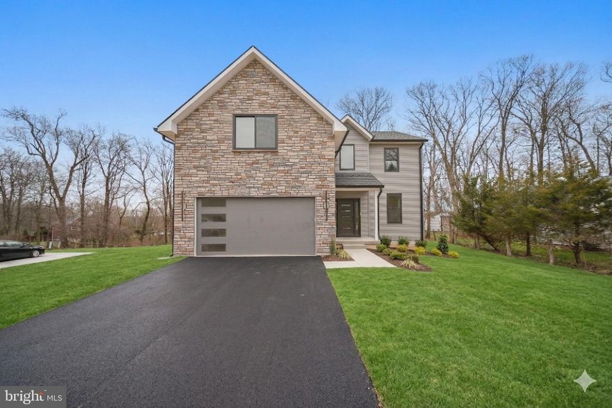 Lawn and driveway are artifically added to enhance the photos. As you walk in, you are welcomed into a light-filled, beautifully designed custom home, where thoughtful craftsmanship and high-end finishes are evident throughout. This fully custom-built new construction residence offers an ideal balance of elegance, comfort, and modern functionality, all set against the serene backdrop of protected open space overlooking a small stream.

The main level features engineered hardwood flooring, expansive living areas, and a convenient first-floor powder room. Designed for both everyday living and entertaining, the heart of the home is the chef’s kitchen, complete with brand-new white and light gray maple shaker-style cabinetry, abundant storage, and a generous bartop perfect for hosting and casual gatherings. The kitchen is further enhanced by granite countertops, stainless steel appliances, and a spacious breakfast area that seamlessly connects indoor and outdoor living.

Just off the breakfast area, step onto the private deck, ideal for grilling, entertaining, or enjoying alfresco dining, with stairs leading directly to the backyard and views of the preserved land beyond.

Functionality continues with a mudroom off the two-car garage, complete with a coat closet—perfect for everyday organization. The home is also equipped with two-zone heating and cooling for energy efficiency and personalized comfort, and is pre-wired for surveillance cameras for added peace of mind.

Upstairs, the home offers four generously sized bedrooms and second-floor laundry, thoughtfully placed for maximum convenience. The layout includes two full bathrooms, providing comfort and privacy for family and guests alike.

The massive unfinished basement, featuring an additional half bathroom, offers endless potential for future expansion—whether as a media room, home gym, additional living space, or custom retreat tailored to your lifestyle.

Combining custom construction, luxury finishes, smart infrastructure, and a peaceful Bucks County setting, this exceptional home presents a rare opportunity to own brand-new, high-end construction in one of Central Bucks’ most desirable locations.