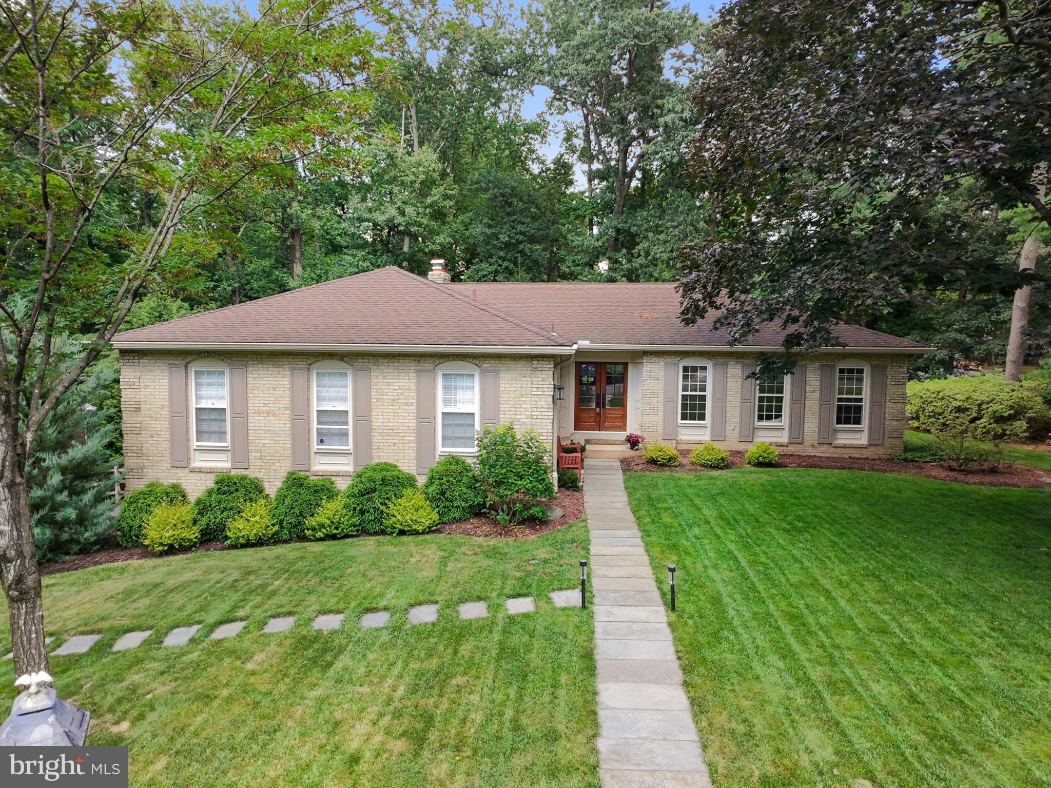 Rarely available in Ridgelea Woods! This beautifully updated brick rambler offers over 3,500 square feet of finished living space in one of Mantua’s most desirable enclaves. From the moment you enter through the newly installed glass double front doors, you'll appreciate the thoughtful updates, elegant finishes, and abundant natural light throughout.
The light-filled main level features refinished hardwood floors and custom wood railings, creating a warm, welcoming ambiance. The sunlit living room is anchored by a gas fireplace and custom built-ins, while the formal dining room opens via French doors to a charming flagstone patio—ideal for seamless indoor-outdoor entertaining.
The updated eat-in kitchen includes stainless steel appliances, a newer gas stove and refrigerator, recessed lighting, and a bright breakfast nook overlooking the professionally landscaped, fenced backyard. A side door offers easy access to the main-level patio.
Three spacious bedrooms are on the main level, including a generous primary suite with a walk-in closet, dressing area, soaking tub, and separate shower.
The fully finished walk-out lower level offers incredible versatility, featuring a large family room with a second gas fireplace, a fourth bedroom, and a full bath—perfect for guests, in-laws, or an au pair. A newly finished multipurpose room with built-in cabinetry and a wet bar provides flexible space for a home gym, media room, or playroom. French doors lead to a second flagstone patio for additional outdoor enjoyment.
Additional highlights include a newly repaved driveway, a side exterior entrance, a laundry room with new washer and dryer, and low average utility costs. Optional membership to the nearby swim and tennis club is available.
Ridgelea Woods offers underground utilities, mature trees, and a true sense of community—just minutes from parks, trails, shopping, and dining. Enjoy close proximity to the Cross County Trail, Eakin Park, Inova Fairfax Hospital, the Mosaic District, and major commuter routes including Route 50, I-495, and the Vienna and Dunn Loring Metro stations.
This home perfectly balances tranquility and accessibility in one of Fairfax County’s most established neighborhoods.