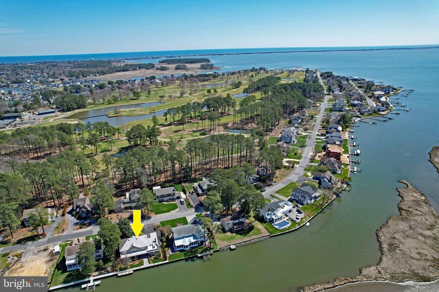 Waterfront home with beautiful views of Rehoboth Bay. Former Cottage-Tour home in move-in condition. Updated with geothermal heat, new roof, and hardwood floors. Large rooms with good flow for quiet living or entertaining.  As you enter the front door, you'll be in awe of the two story living room that leads out to the screened porch overlooking the bay.   First floor spacious primary bedroom with an equally spacious closet that will amaze you.   Primary bath has jetted tub and separate shower.  Den with  built-in bookshelves for all of those novels you can't wait to read.   And, of course, a kitchen you won't want to leave.  Granite counters, double oven,  microwave, wine cooler, and so much counter space.  Great room off the kitchen has a brick fireplace for those cool evenings.  Separate laundry room.  Rennai tankless hot water heater.   Geothermal heat and air on the first floor.  Screened porch for your morning coffee or evening drinks and perfect for entertaining.  Upper sundeck overlooks your private dock and Bay. Close to downtown Rehoboth and fine restaurants; a short drive to tax-free outlet shopping,  Don't wait to see this beautiful home.   It won't last long.