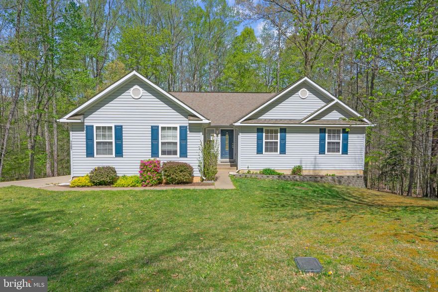 Cute as a button!  Centrally located within KG County.  Just a hop, skip and jump to Dahlgren, Fredericksburg or Quantico...Welcome to the sought after Presidential Lakes Community.  Enjoy summers fishing, and swimming, at one the multiple lakes, or in the recently remodeled neighborhood pool.  The concrete driveway leads to an oversized, side load, two car garage.  The open floorplan is highlighted with cathedral ceilings, and hardwood flooring.  Like new upgraded Samsung stainless steel appliances.  A huge custom sun deck which stretches' the length of the house, with access points from the kitchen and primary bedroom.  All overlooking your large, flat, private piece of paradise that backs to trees.  The full, walk out, unfinished basement offers tons of room for growth or/and storage!  Move in ready and ready for someone new to make this "home".  Truly a must see!