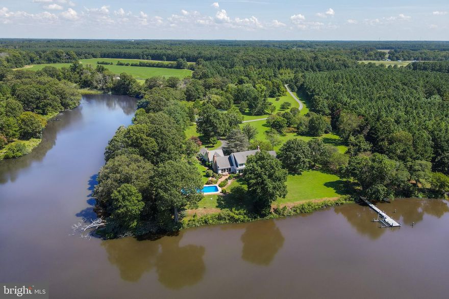 Spectacular Waterfront retreat sited along Island Creek on over 34 lush landscaped acres, this custom-built residence in Patrick’s Plains offers over 1,100 feet of shoreline, a pier with lifts, 2 ponds, a waterside pool, tennis court, mature landscaping, open vistas, and mature landscaping all providing for complete privacy. With a location that's only a few miles off of U.S. Route 50, it provides easy access to the Washington metro area and is only a short distance to the towns of Oxford, St. Michael’s and Easton.  Inside this custom-built house, there are wide heart pine floors and crown molding throughout , with a welcoming foyer, office with built-ins, living room with wood-burning fireplace, large eat-in kitchen with a center island, dining room with beautiful views of the creek, and a family room with a wood-burning fireplace that overlooks the backyard and pool area. There is also a main level master suite with a walk-in closet and ensuite bath with dual vanities, soaking tub and separate shower. Upstairs, there are three additional bedrooms, two full baths, and a recreation room.  The property is completed by a 3-Car Garage and separate shed for a car or boat. Truly as must see.