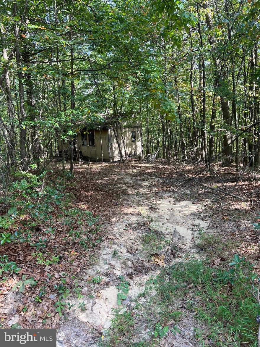 This expansive 6.36-acre property, nestled within Valley High Timber Farms Inc subdivision, presents a unique opportunity for those seeking a rustic retreat. The centerpiece of this parcel is a  cabin in need of some tender loving care or torn down and rebuilt. Offering the potential to be transformed into a cozy haven. Access to the property is via a rugged road that requires caution, making it advisable for larger vehicles to navigate comfortably.

This property is being sold "as is, where is," emphasizing the importance of prospective buyers conducting thorough due diligence. The land's generous size and its cabin's potential for rehabilitation provide an intriguing canvas for those with a vision for a tranquil countryside escape. Whether you're seeking a private getaway or an investment project, this property offers a world of possibilities in a serene natural setting.  (NO WELL/SEPTIC OR ELECTRICITY )THEIR ARE POWER POLES AT THE FRONT OF THE PROPERTY and above  GROUND. Please reach out to (Listing) agent before you go view the property.