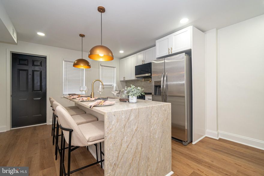 **BACK ON THE MARKET** And move in ready!! Welcome to 2560 Cecil Ave, a fully renovated 3-bedroom, 3 full bathroom home offering modern upgrades, stylish finishes, and a thoughtful layout in the heart of Baltimore.

Step inside to discover luxury vinyl tile flooring throughout, an open-concept main level with an electric fireplace as the centerpiece, and high-end light fixtures that bring sophistication to every room. The kitchen is a chef’s dream with brand-new stainless steel appliances, a gas stove, sleek cabinetry, and a pot filler that adds both function and flair.

Upstairs, you’ll find two spacious bedrooms including a primary suite with its own private full bath. The washer and dryer hookup is conveniently located on this floor, adding ease to your laundry routine. The third bedroom and an additional full bath are located in the fully finished basement.

This home is complete with all new windows and doors, central air conditioning, electric heat, and a brand-new deck in the backyard.

Grant assistance may be available for qualified buyers