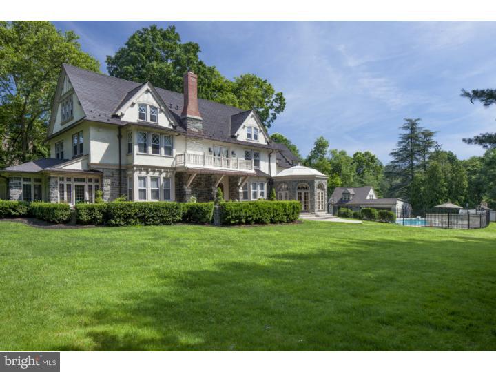 This completely updated grand stone & stucco manor home offers authentic architectural details & all the amenities you want. The new lavish baths & huge stainless/granite chef's kitchen (6+ burner Wolf range & 2 addt'l Decor wall ovens) are only the beginning. Four floors of living feature an elaborately detailed foyer with mercer tile & wainscoting that leads to the elegant fireside living room. A casually chic family room offers a fireplace w/ built-ins & French doors to a 3 season conservatory. An "Octagon Room" has atrium doors, a fireplace & Mercer tile. Spacious rooms for living & entertaining include: built-in cabinetry w/ leaded glass doors, wide moldings, pocket doors, carved mantels, Mercer tiles, wood floors thru-out most & so much more. The master suite features a large sitting room, balcony, walk in closet, fireplace & stunning bath w/ marble, whirlpool tub & oversized shower. Finished lower level has loads of storage, wine cellar & game rooms. Dazzling pool, patios & a 2-sty carriage house.