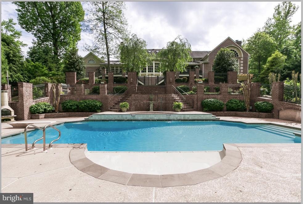 Stunning property in the water privileged community of Belleview Estates! 10,000sq ft on almost an acre of land. Radiant heat flooring, high-end custom finishes, hardware & lighting. Gourmet kitchen w/Viking appl, Florida room, Great Rm w/stone FP, replica of McGarvey's Bar, in-home gym, in-law suite,wine cellar, pool w/hot tub, sports court, outdoor kitchen, beautiful gardens and much more!.