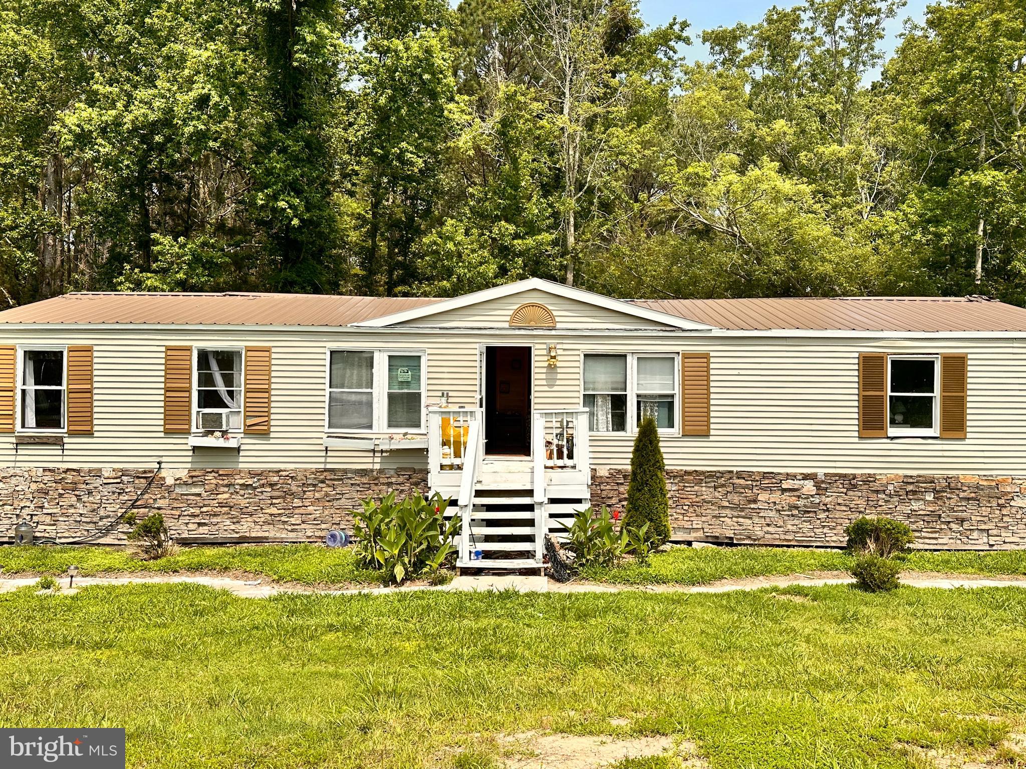 Nestled on a secluded, wooded 2-acre lot just outside of Crisfield, this charming 3-bedroom, 2-bathroom ranch-style home offers the ideal blend of space, comfort, and country serenity. With 1,380 square feet of living space and an inviting open-concept floor plan, this property is perfect for first-time buyers or anyone looking to slow down and savor the quiet life.
Step inside to find laminate flooring throughout, spacious bedrooms adorned with decorative accent trim, and a large soaking tub in the primary suite—your personal retreat at the end of the day. The front porch provides the perfect spot to enjoy peaceful country views with your morning coffee or evening breeze.
Conveniently located just minutes from Crisfield’s renowned fishing and boating, and within a short drive to Salisbury (30 minutes) and Ocean City (45 minutes), this property offers the best of both tranquility and accessibility.
Don’t miss this rare opportunity to own a slice of country living with all the comforts of home. Call today to schedule your private tour!
