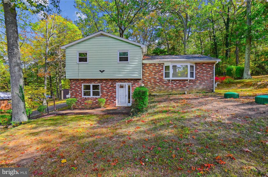Welcome to this cozy split-level home with a NEW roof and NEW septic system. Once you walk in the front door you will be greeted by a grand room with a wood-burning fireplace. Make your way upstairs where you will find the living room and dining room with hardwood floors and kitchen with a stove top center island. Just beyond the kitchen is the door to the rear deck which overlooks the wooded backyard. Head back inside to check out the top level with 3 bedrooms and 1.5 bathrooms. Once done inside, you can make your way outside to the detached garage where, in addition to parking, you will find plenty of storage space. Within walking distance from Deer Park  Recreation  Field. The only thing left to do is submit an offer to make this house YOURS!!!