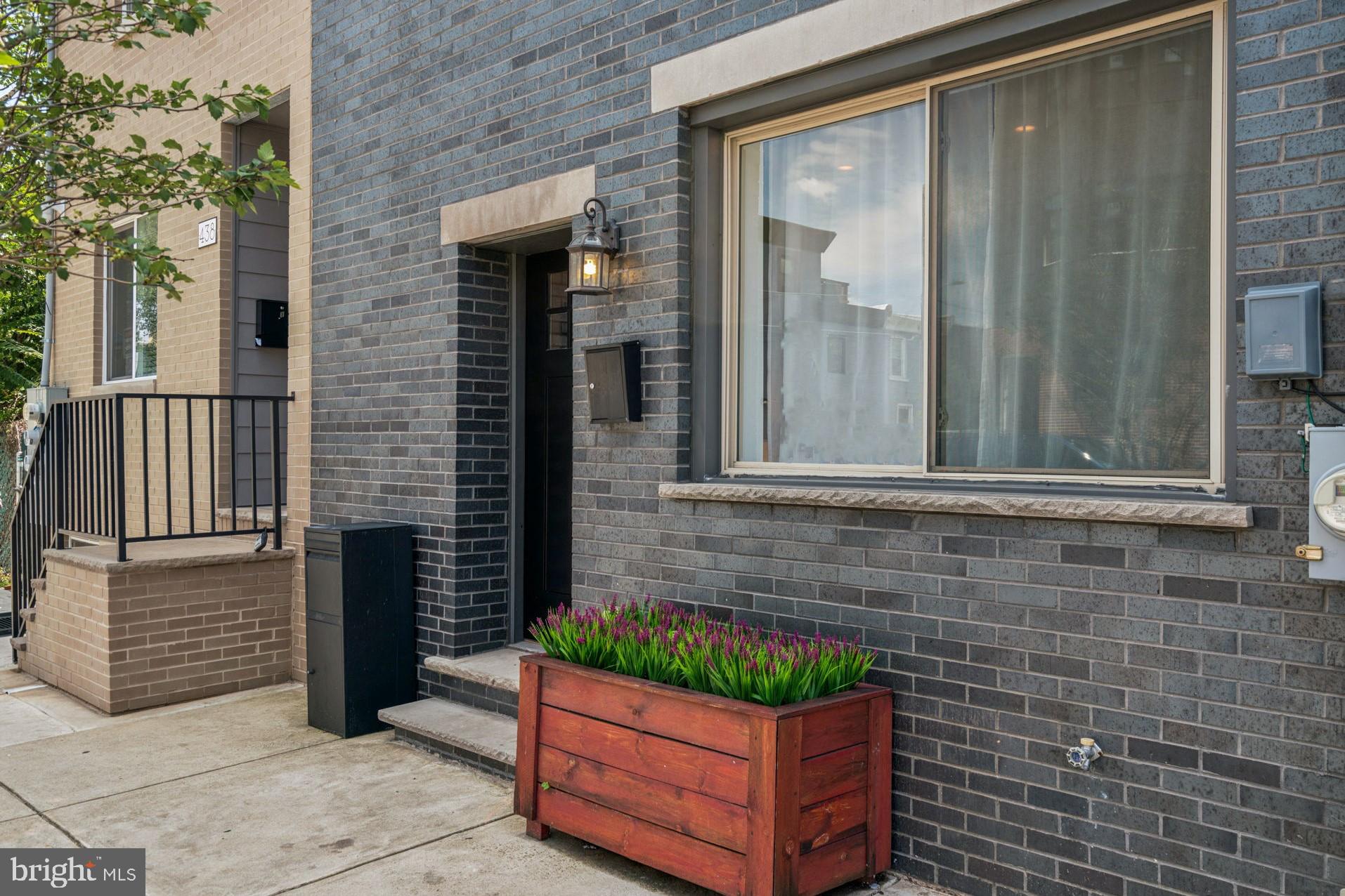 Welcome to this spacious and thoughtfully designed 17-foot-wide home in up-and-coming Norris Square, filled with natural light and modern touches throughout. The main level features an open floor plan with high tray ceilings, recessed lighting, and a convenient half bath. The chic kitchen includes 42-inch cabinets, marble countertops, stainless steel appliances, subway tile backsplash, a large island, and an externally vented exhaust hood. Just beyond the kitchen, enjoy a private patio perfect for grilling or relaxing with your morning coffee.
Upstairs, the second level offers a bright and spacious rear bedroom with a large closet, a stylish hall bath with a reclaimed wood double vanity, and a convenient laundry area. Completing this level is an additional bedroom with a massive walk-in closet, practically a room of its own. The third floor is dedicated to the primary suite, complete with a king-sized bedroom, two double-wide closets, and a luxurious en suite bath featuring a glass shower, soaking tub, and marble double vanity. A rooftop deck with skyline views completes this impressive home, located close to Temple University and all that East Kensington, Olde Kensington, and Fishtown have to offer.