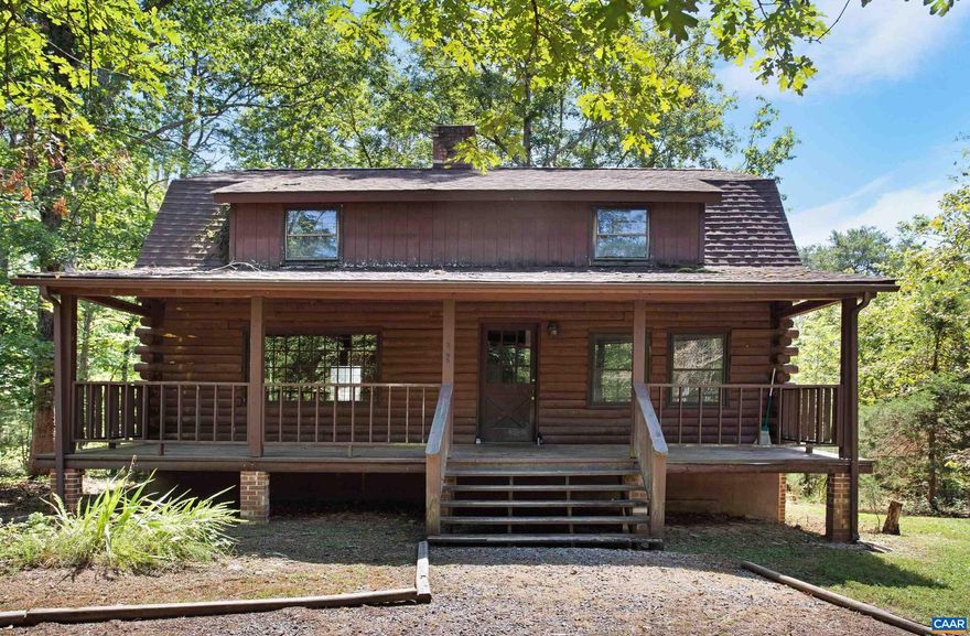 This 3-BED, 1.5-BATH, 1584 FINISHED SQ FT LOG CABIN sits on 11.53 GORGEOUS WOODED ACRES along a QUIET CUL-DE-SAC and features an inviting ROCKING CHAIR FRONT PORCH, serene CREEK/STREAM, and 792 UNFINISHED SQ FT WALK-OUT BASEMENT just perfect for storage or adding to the overall finished living space! Enjoy ultimate peace and quiet while also being CONVENIENTLY LOCATED just 10-15 minutes from Belmont, the historic Downtown Mall, and 5th Street Station! Featuring endless character, a WOOD-BURNING FIREPLACE, and breath-taking nature views from every window, this "AS IS" home has so much potential! OPEN HOUSE SUNDAY 9/10 12-2PM! Home is being sold "AS IS." Septic was pumped Aug 2023.,Wood Cabinets,Fireplace in Basement,Fireplace in Living Room