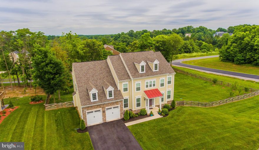 Exquisite 5057 sf, 5Bed, 4.5Bath Executive Home with private office minutes just minutes from historic Shepherdstown.  Located in the highly desirable Shepherdstown School District!  Move-in ready and better than new!  Beautiful wide plank hardwood flooring throughout first floor adds sophistication throughout.  Gorgeous white kitchen with oversized island, granite countertops, glass backsplash, LED under-cabinet lighting, designer chandeliers, all SS appliances and RO water system.  Open concept family room with gas fireplace, custom architectural moldings and huge windows with lots of light.  Sprawling master retreat with double door entry, attached sitting room, tray ceiling, new crown molding and large walk-in closet with custom closet system and 2 chandeliers.   Spacious master bath with granite counters, oversized glass shower with bench seat and private water closet.  Upstairs includes princess suite with full bath and custom closet system, additional full bath with double sinks and 2 more oversized bedrooms with custom walk-in closets.  Gorgeous 2nd floor laundry room with soft close custom cabinetry, granite countertops and stainless sink.  Finished basement includes 5th bedroom and full bath.  Basement upgrades include 9-foot ceilings, entertainment area with built in speakers, refrigerator water/ice hook up and custom crown molding throughout. Unfinished utility area includes water treatment systems, 2 water heaters and 2 air handlers (dual zoned).  Basement walks out on private patio with lighted pergola great for entertaining.  Second floor Trex deck off the eat in kitchen and the pergola patio both overlook private, fenced 1+ acre lot with fruit trees, Amish hardwood shed.  Oversized two car garage with built-in shelving walks into beautiful mudroom with custom cabinetry, one of a kind mercury glass pendant light, coat hooks and shoe storage bins.  Too many upgrades to mention them all   This house has everything you could need, want and more!