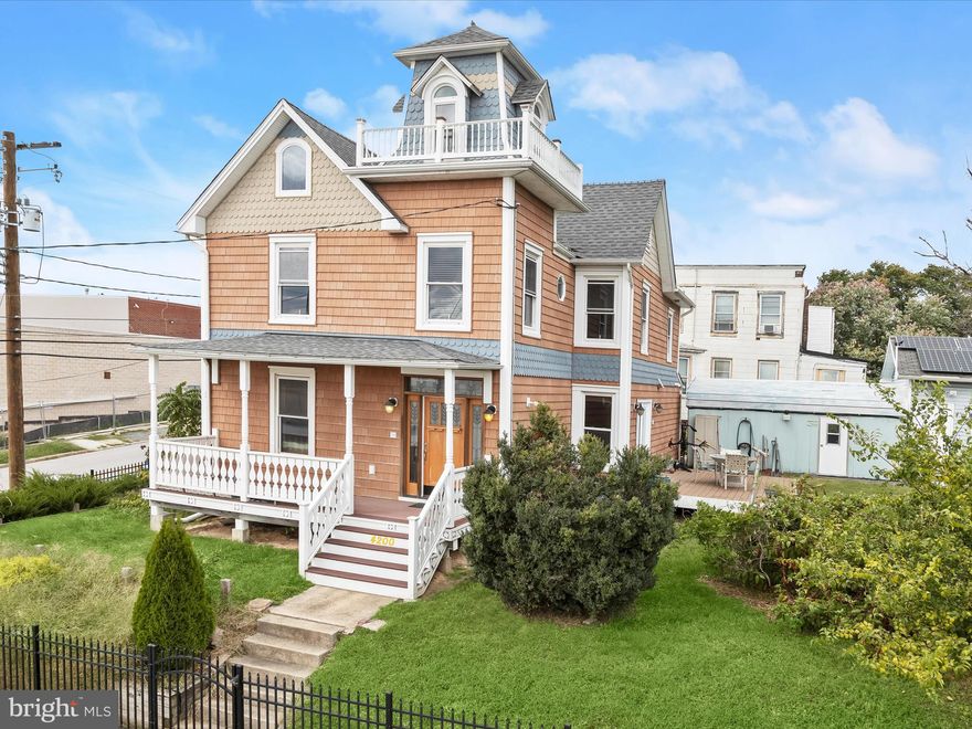 > IMMEDIATE AVAILABILITY <This Stunning Victorian Gem Offers Over 2,000 Sq Ft Of Living Space And Includes A Rear Lot That Conveys With The Sale, Providing Expanded Outdoor Possibilities And Added Value. Lovingly Updated To Honor Its History While Embracing Modern Living, The Home Welcomes You With A Captivating Façade Featuring A Covered Front Porch, Cedar Impressions Siding With Fish Scale Detailing, And The Original Widow’s Walk Offering Sweeping City Views. Inside, The Main Hall Foyer Showcases Etched Glass Accents & Rich Hardwood Floors Leading To A Living Room Adorned With Custom Millwork. The Library Features Custom Built-In Shelving, Wall Sconces and A Sunlit Bay Window That Evokes Early 20th-Century Charm. The Dining Room, Framed By A Ceiling Medallion & Chandelier, Sets The Stage For Both Casual Meals And Festive Gatherings. The Gourmet Kitchen Boasts Granite Countertops, Handcrafted Cabinetry, Stainless Steel Appliances, A Double Wall Oven, Gas Cooktop With Downdraft Hood, And A Tin Ceiling Illuminated By Recessed Lighting. A Spacious Pantry And Main-Level Powder Room Complete The Main Floor. Upstairs, The Primary Bedroom Impresses With a Cathedral Ceiling And Custom Walk-In Closet. Three Additional Bedrooms—Including One Currently Used As A Laundry Room—Share A Beautifully Renovated Bath With Double Vanity And Frameless Glass Shower. The Uppermost Level Features The Historic Widow’s Walk, While The Basement Offers Ample Storage. Outside, Enjoy A Composite Patio With Hot/Cold Water Hookup, A Powered Workshop Shed & a Detached Garage. This Home Is A Rare Opportunity To Own A Piece Of Baltimore History In The Orangeville Neighborhood. Easy Access Out to All Major Routes Including I 95.